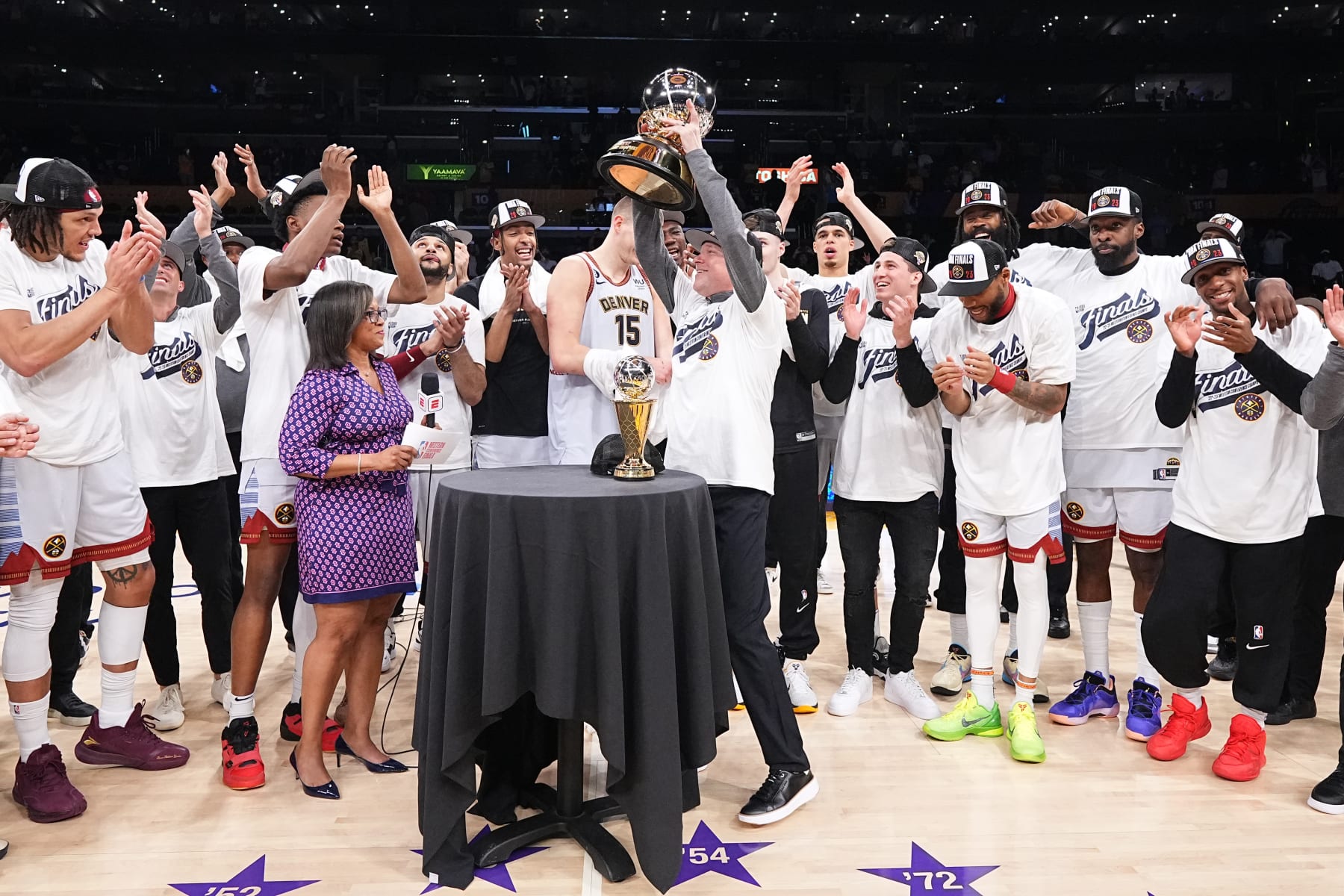 LOS ANGELES, CA - MAY 22: The Denver Nuggets are presented with the Oscar Robertson Western Conference Champion trophy after winning Game Four of the Western Conference Finals against the Los Angeles Lakers on May 22, 2023 at Crypto.com Arena in Los Angeles, California. NOTE TO USER: User expressly acknowledges and agrees that, by downloading and/or using this Photograph, user is consenting to the terms and conditions of the Getty Images License Agreement. Mandatory Copyright Notice: Copyright 2023 NBAE (Photo by Garrett Ellwood/NBAE via Getty Images)