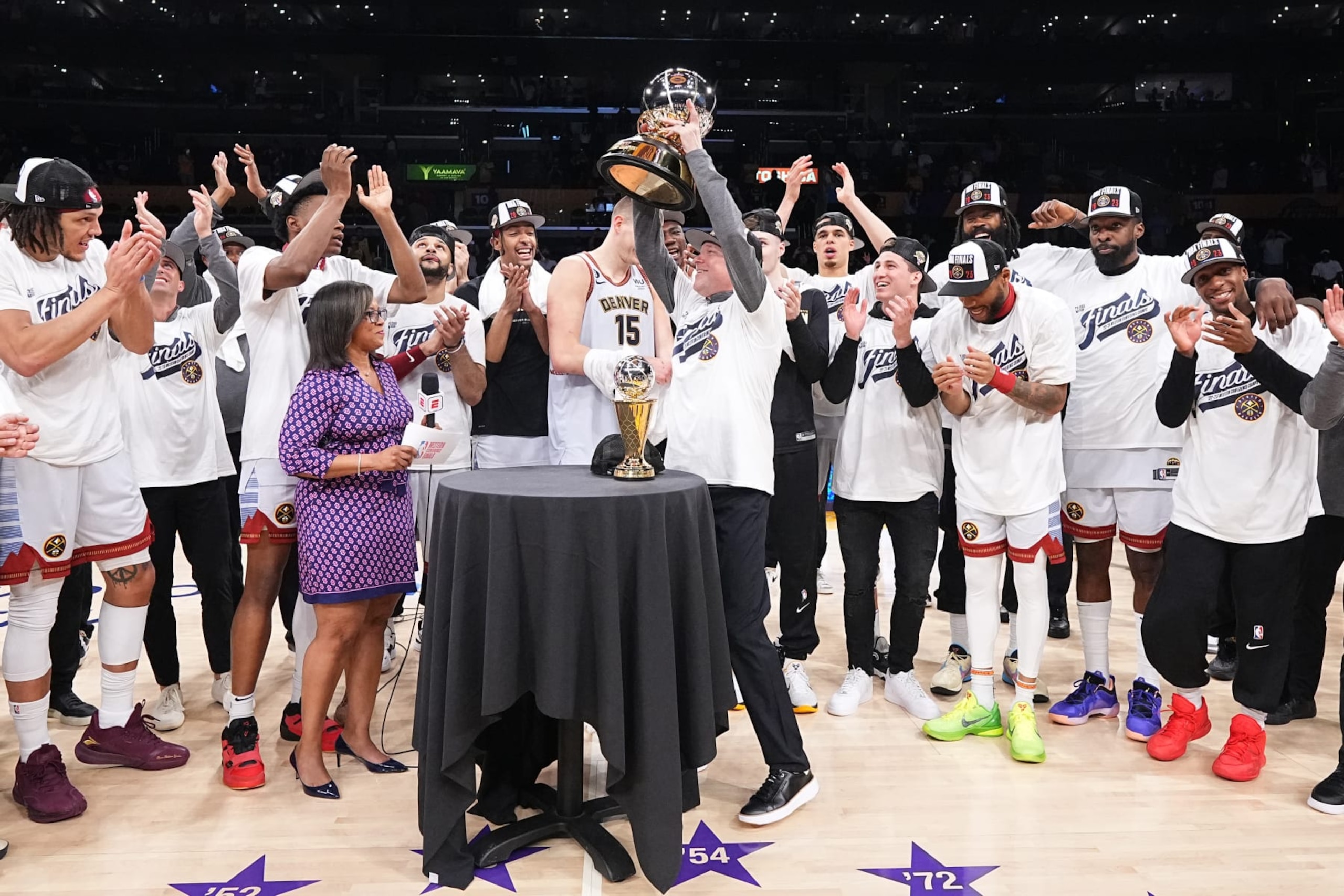LOS ANGELES, CA - MAY 22: The Denver Nuggets are presented with the Oscar Robertson Western Conference Champion trophy after winning Game Four of the Western Conference Finals against the Los Angeles Lakers on May 22, 2023 at Crypto.com Arena in Los Angeles, California. NOTE TO USER: User expressly acknowledges and agrees that, by downloading and/or using this Photograph, user is consenting to the terms and conditions of the Getty Images License Agreement. Mandatory Copyright Notice: Copyright 2023 NBAE (Photo by Garrett Ellwood/NBAE via Getty Images)