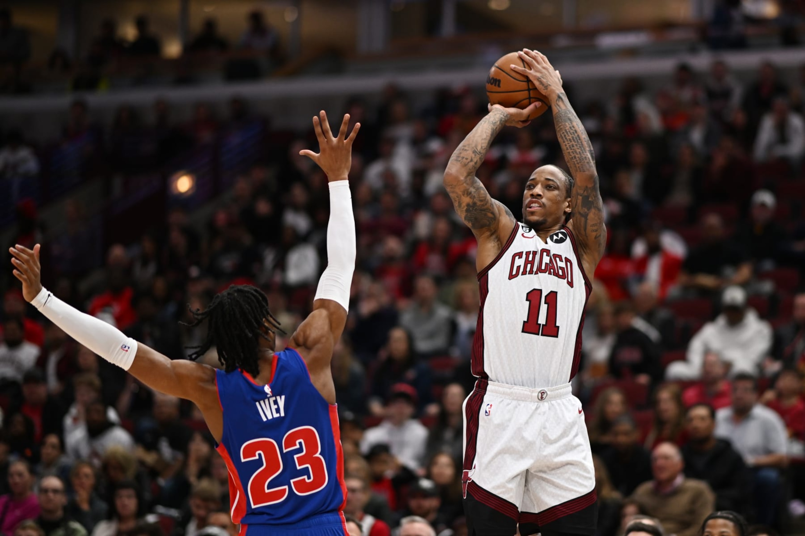 CHICAGO, ILLINOIS - APRIL 09: DeMar DeRozan #11 of the Chicago Bulls shoots in the first half against Jaden Ivey #23 of the Detroit Pistons at United Center on April 09, 2023 in Chicago, Illinois.   NOTE TO USER: User expressly acknowledges and agrees that, by downloading and or using this photograph, User is consenting to the terms and conditions of the Getty Images License Agreement.  (Photo by Quinn Harris/Getty Images)