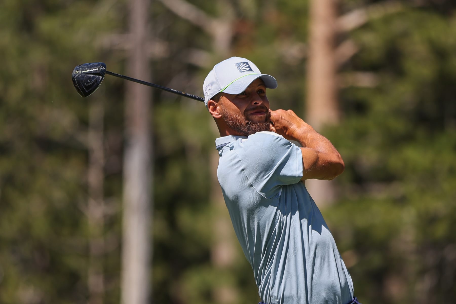 STATELINE, NEVADA - JULY 15: Stephen Curry of the NBA Golden State Warriors hits his tee on the 18th hole on Day Two of the 2023 American Century Championship at Edgewood Tahoe Golf Course on July 15, 2023 in Stateline, Nevada. (Photo by Isaiah Vazquez/Getty Images)