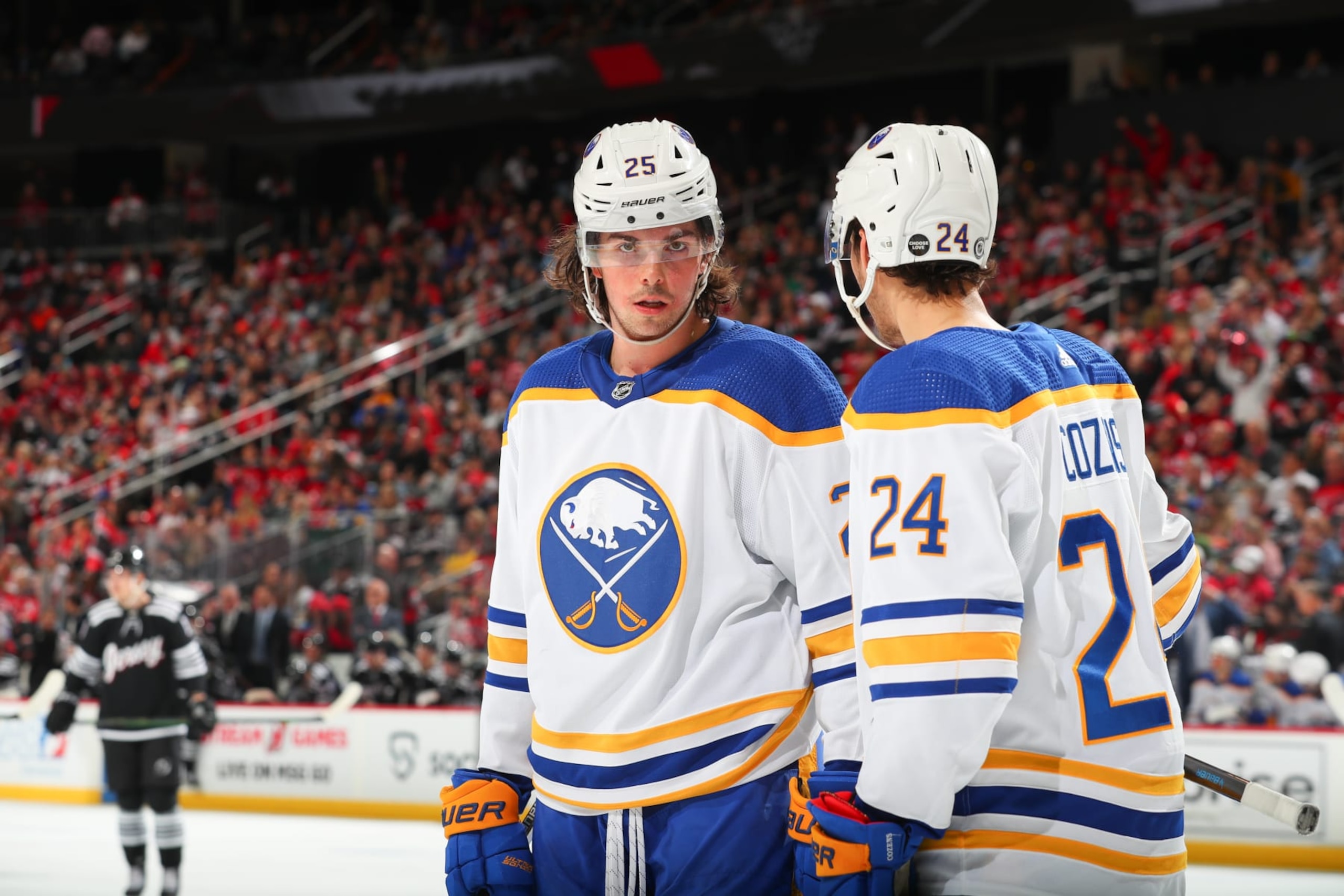 NEWARK, NJ - APRIL 11: Owen Power #25 of the Buffalo Sabres and Dylan Cozens #24 of the Buffalo Sabres in the third period of the game against the New Jersey Devils on April 11, 2023 in Newark, New Jersey.  (Photo by Rich Graessle/NHLI via Getty Images)