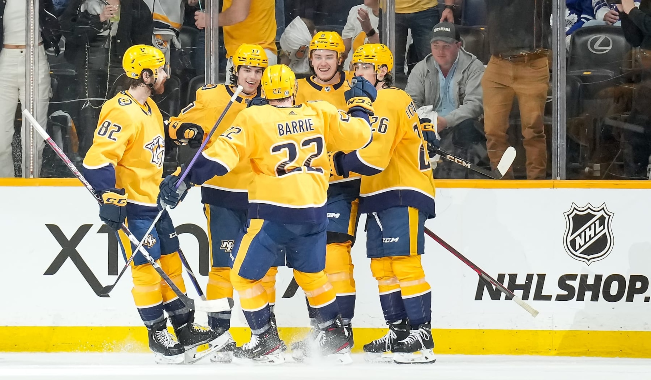 NASHVILLE, TENNESSEE - MARCH 26: Cody Glass #8 celebrates his goal with Luke Evangelista #77, Tyson Barrie #22, Philip Tomasino #26 and Tommy Novak #82 of the Nashville Predators against the Toronto Maple Leafs during an NHL game at Bridgestone Arena on March 26, 2023 in Nashville, Tennessee. (Photo by John Russell/NHLI via Getty Images)