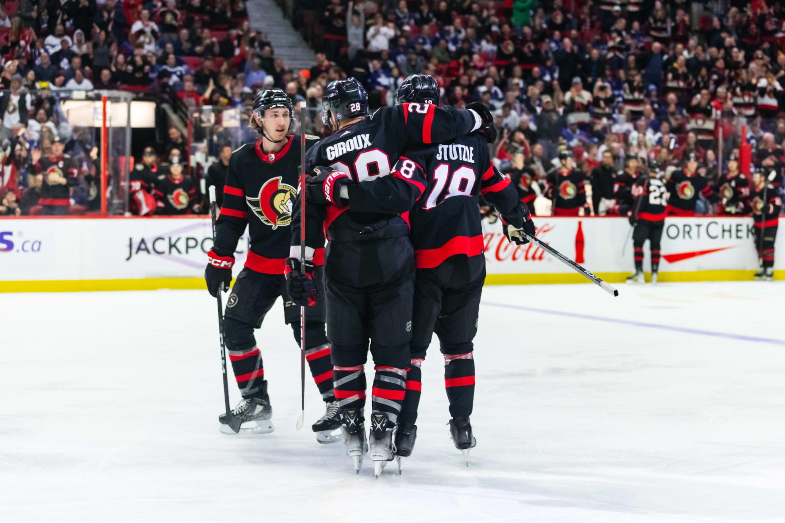 OTTAWA, ON - MARCH 18: Ottawa Senators Center Tim Stutzle (18) celebrates his goal with Right Wing Claude Giroux (28) and Defenceman Jake Sanderson (85) during second period National Hockey League action between the Toronto Maple Leafs and Ottawa Senators on March 18, 2023, at Canadian Tire Centre in Ottawa, ON, Canada. (Photo by Richard A. Whittaker/Icon Sportswire via Getty Images)