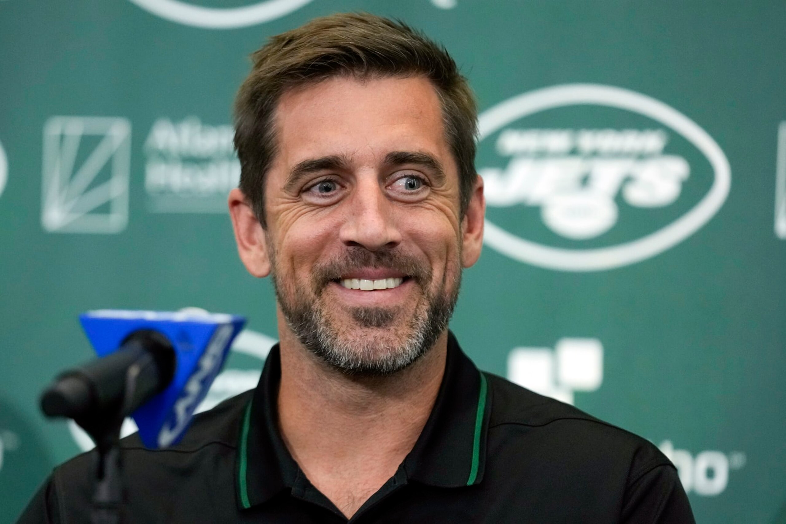 FILE - New York Jets' quarterback Aaron Rodgers smiles during an NFL football news conference at the Jets' training facility in Florham Park, N.J., Wednesday, April 26, 2023. Months after Colorado’s voters decided to join Oregon in decriminalizing psychedelic mushrooms, Denver will host a conference this week put on by a psychedelic advocacy group bringing together an unlikely cohort of speakers — including Rodgers, former Texas Gov. Rick Perry, and rapper Jaden Smith, the son of actor Will Smith. (AP Photo/Seth Wenig, File)