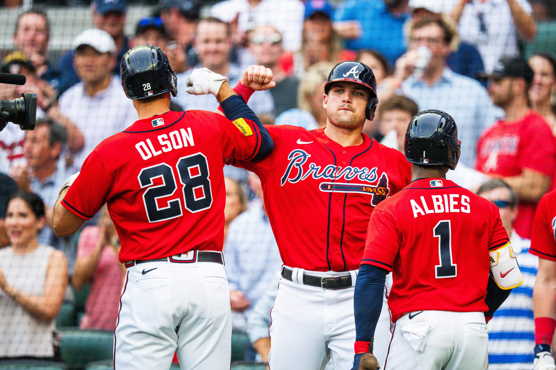 ATLANTA, GA - JULY 14: Austin Riley #27 of the Atlanta Braves congratulates Matt Olson #28 after he hit 
a grand slam during the first inning against the Chicago White Sox at Truist Park on July 14, 2023 in Atlanta, Georgia. (Photo by Kevin D. Liles/Atlanta Braves/Getty Images)