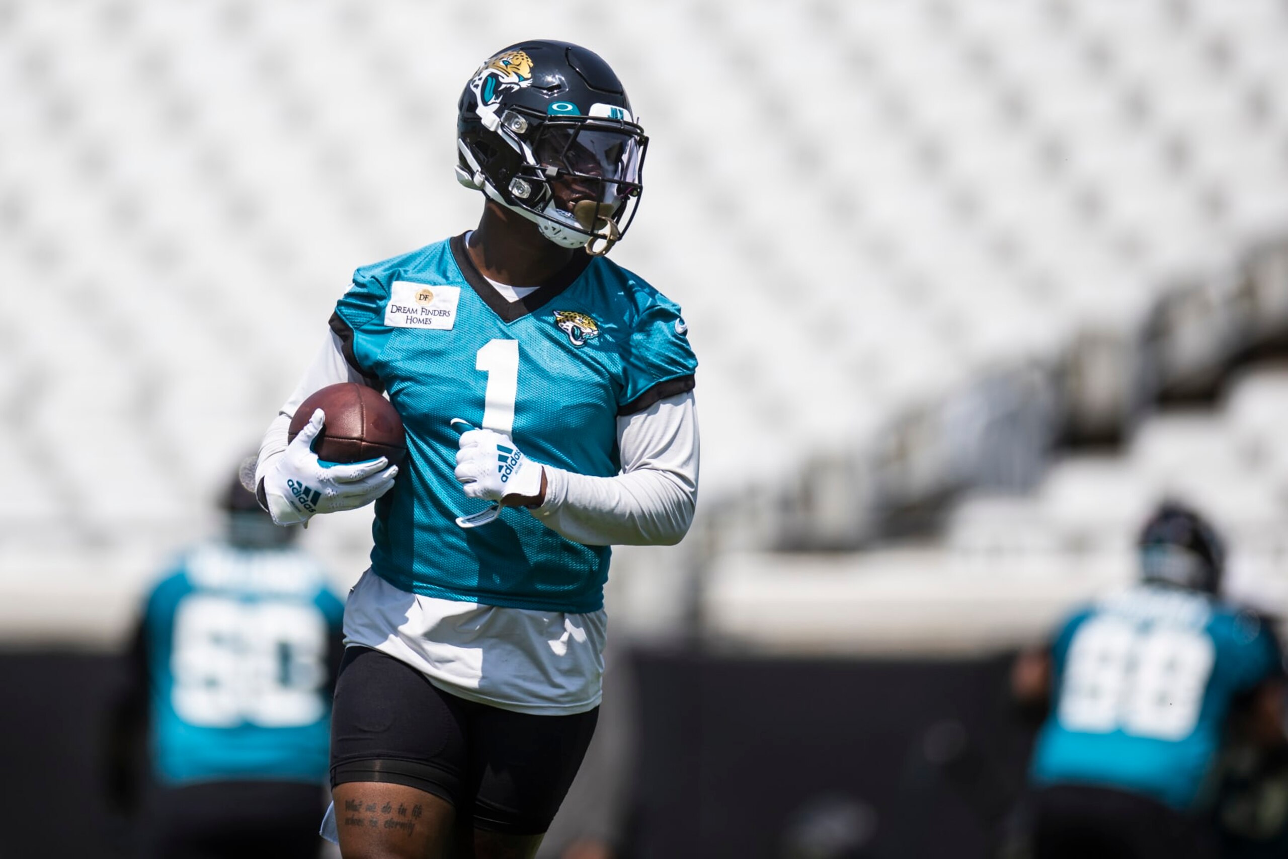 JACKSONVILLE, FLORIDA - MAY 30: Travis Etienne Jr. #1 of the Jacksonville Jaguars looks on during an offseason workout on May 30, 2023 at TIAA Bank Field in Jacksonville, Florida. (Photo by James Gilbert/Getty Images)