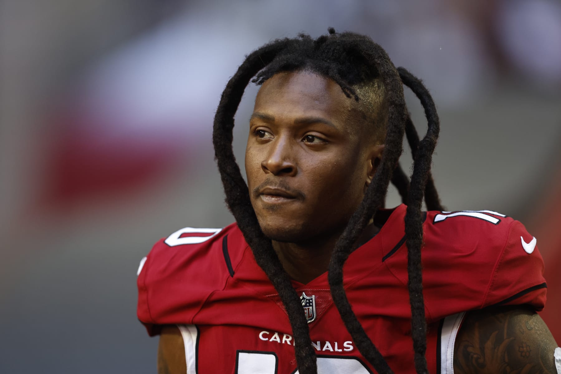 GLENDALE, ARIZONA - NOVEMBER 06: DeAndre Hopkins #10 of the Arizona Cardinals looks on as he takes the field prior to an NFL Football game between the Arizona Cardinals and the Seattle Seahawks at State Farm Stadium on November 06, 2022 in Glendale, Arizona. (Photo by Michael Owens/Getty Images)