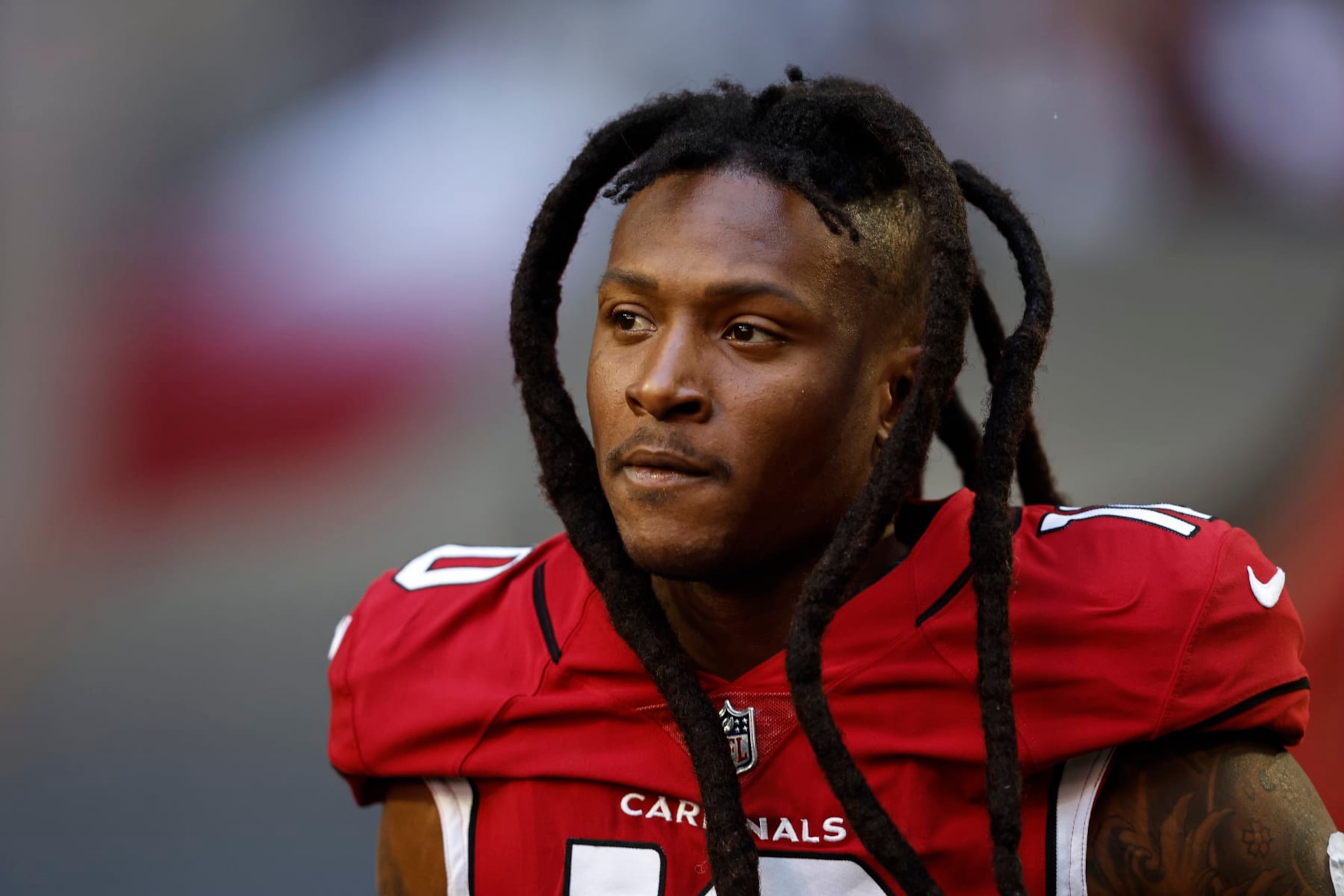 GLENDALE, ARIZONA - NOVEMBER 06: DeAndre Hopkins #10 of the Arizona Cardinals looks on as he takes the field prior to an NFL Football game between the Arizona Cardinals and the Seattle Seahawks at State Farm Stadium on November 06, 2022 in Glendale, Arizona. (Photo by Michael Owens/Getty Images)