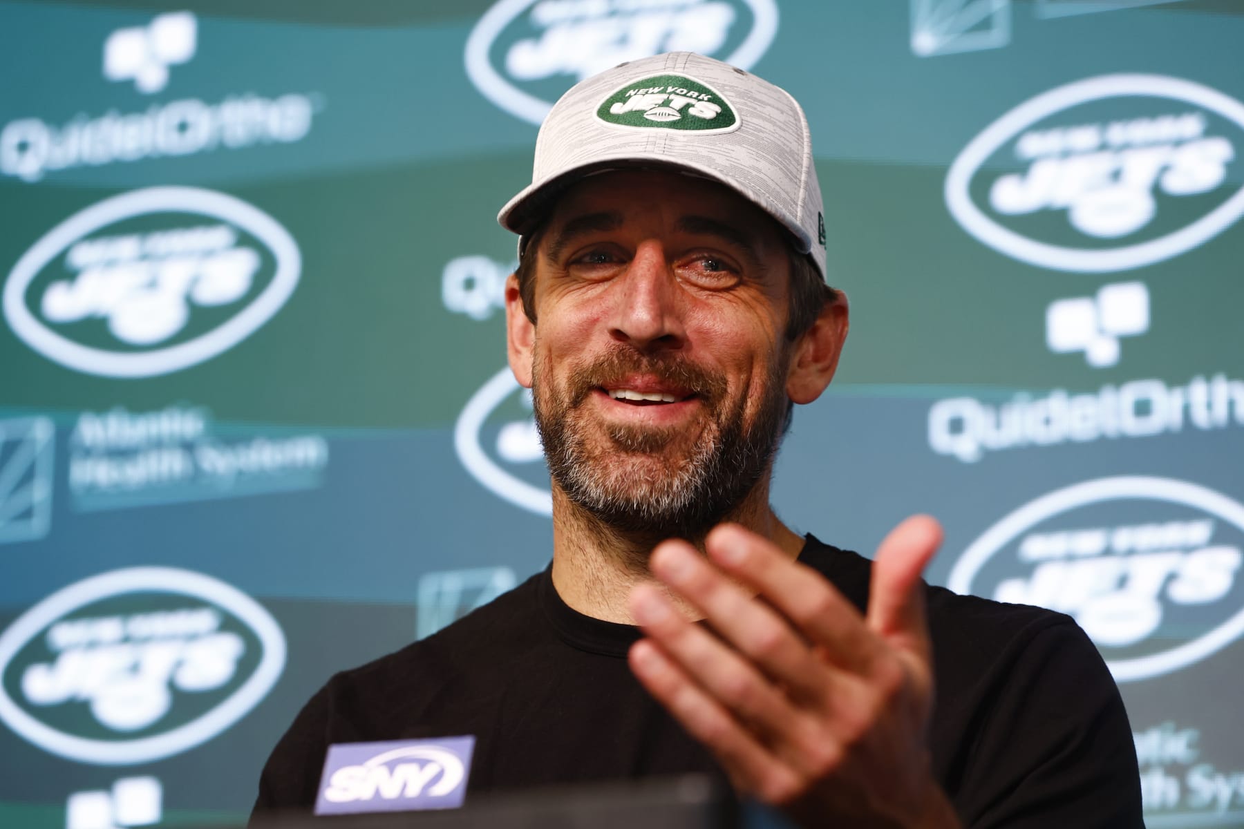 FLORHAM PARK, NEW JERSEY - JUNE 9: Quarterback Aaron Rodgers #8 of the New York Jets talks to reporters after the teams OTAs at Atlantic Health Jets Training Center on June 9, 2023 in Florham Park, New Jersey. (Photo by Rich Schultz/Getty Images)