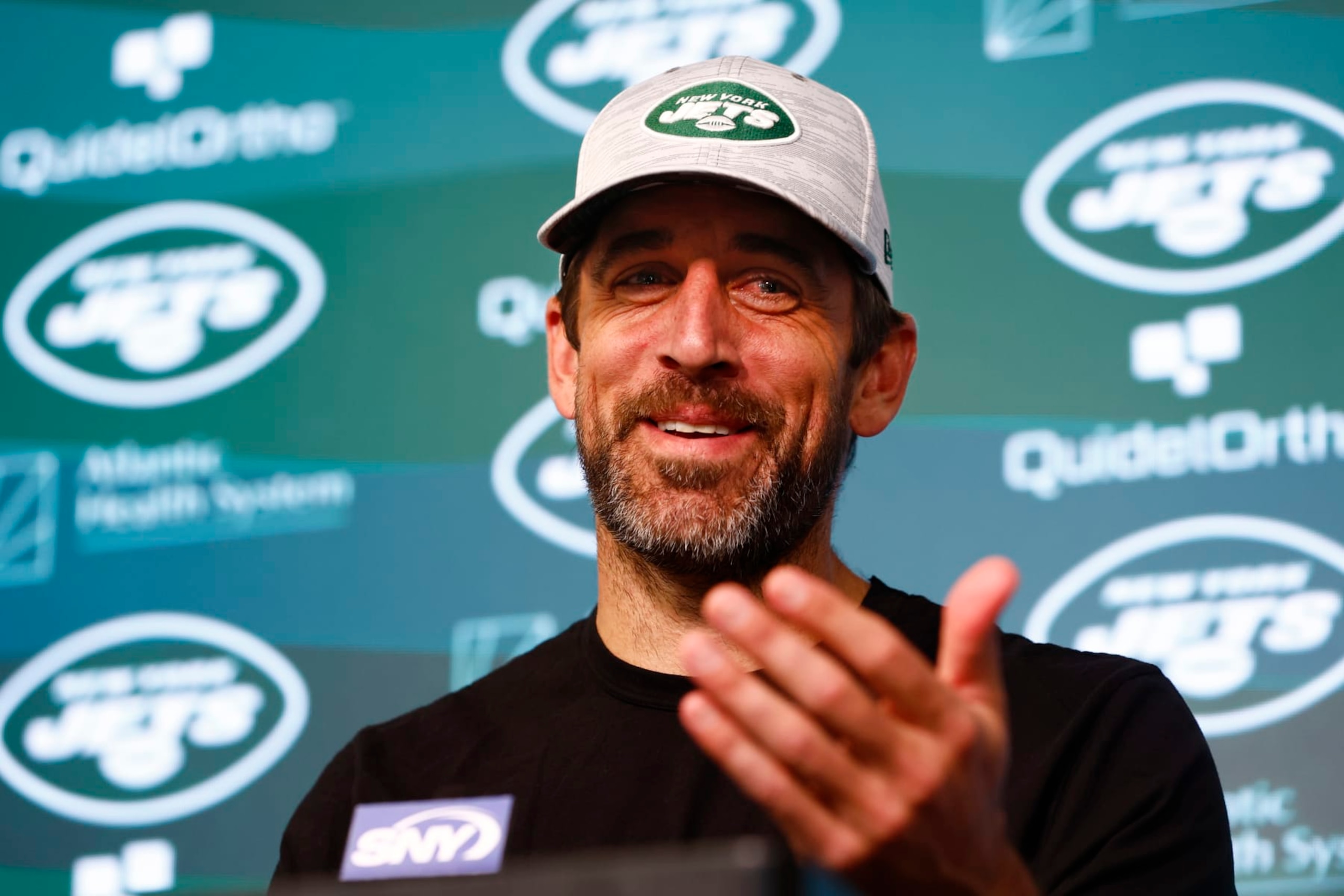 FLORHAM PARK, NEW JERSEY - JUNE 9: Quarterback Aaron Rodgers #8 of the New York Jets talks to reporters after the teams OTAs at Atlantic Health Jets Training Center on June 9, 2023 in Florham Park, New Jersey. (Photo by Rich Schultz/Getty Images)