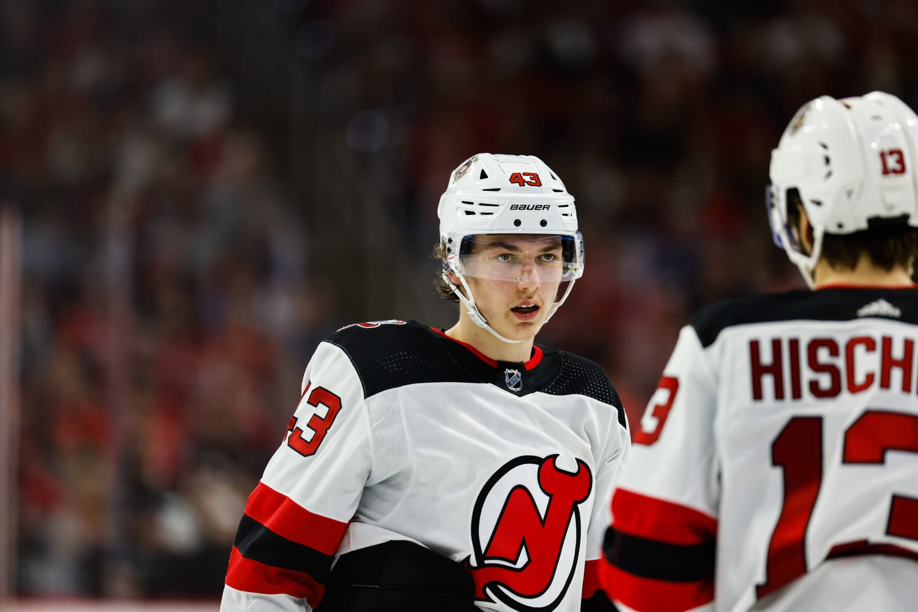 RALEIGH, NC - MAY 11: Luke Hughes #43 of the New Jersey Devils looks on against Carolina Hurricanes during the third period of Eastern Conference Game Five of the Second Round of the 2023 Stanley Cup Playoffs at PNC Arena on May 11, 2023 in Raleigh, North Carolina. (Photo by Jaylynn Nash/Getty Images)
