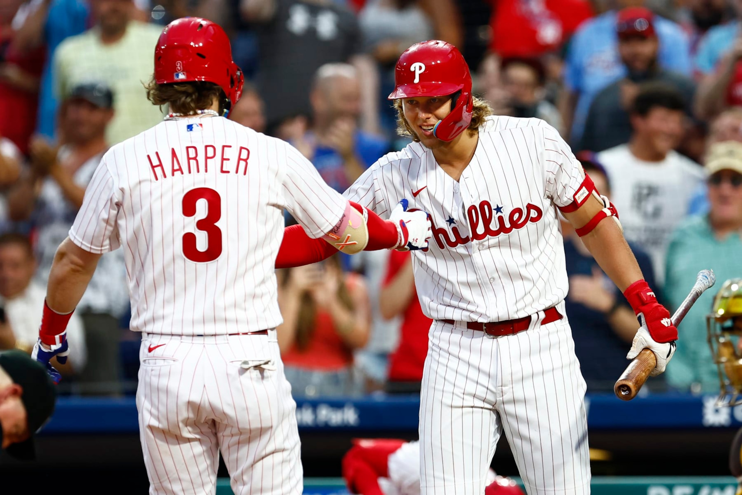 Bryce Harper (L) and Alec Bohm (R)