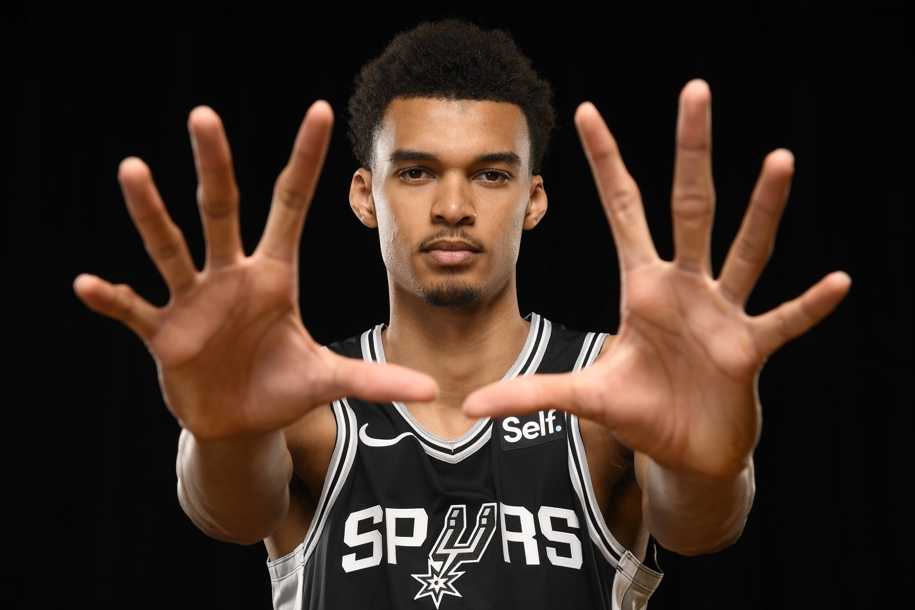 LAS VEGAS, NV - JULY 12: Victor Wembanyama #1 of the San Antonio Spurs for a portrait during the 2023 NBA Rookie Photo Shoot on July 12, 2023 at the University of Nevada, Las Vegas campus in Las Vegas, Nevada. NOTE TO USER: User expressly acknowledges and agrees that, by downloading and/or using this Photograph, user is consenting to the terms and conditions of the Getty Images License Agreement. Mandatory Copyright Notice: Copyright 2023 NBAE (Photo by Brian Babineau/NBAE via Getty Images)