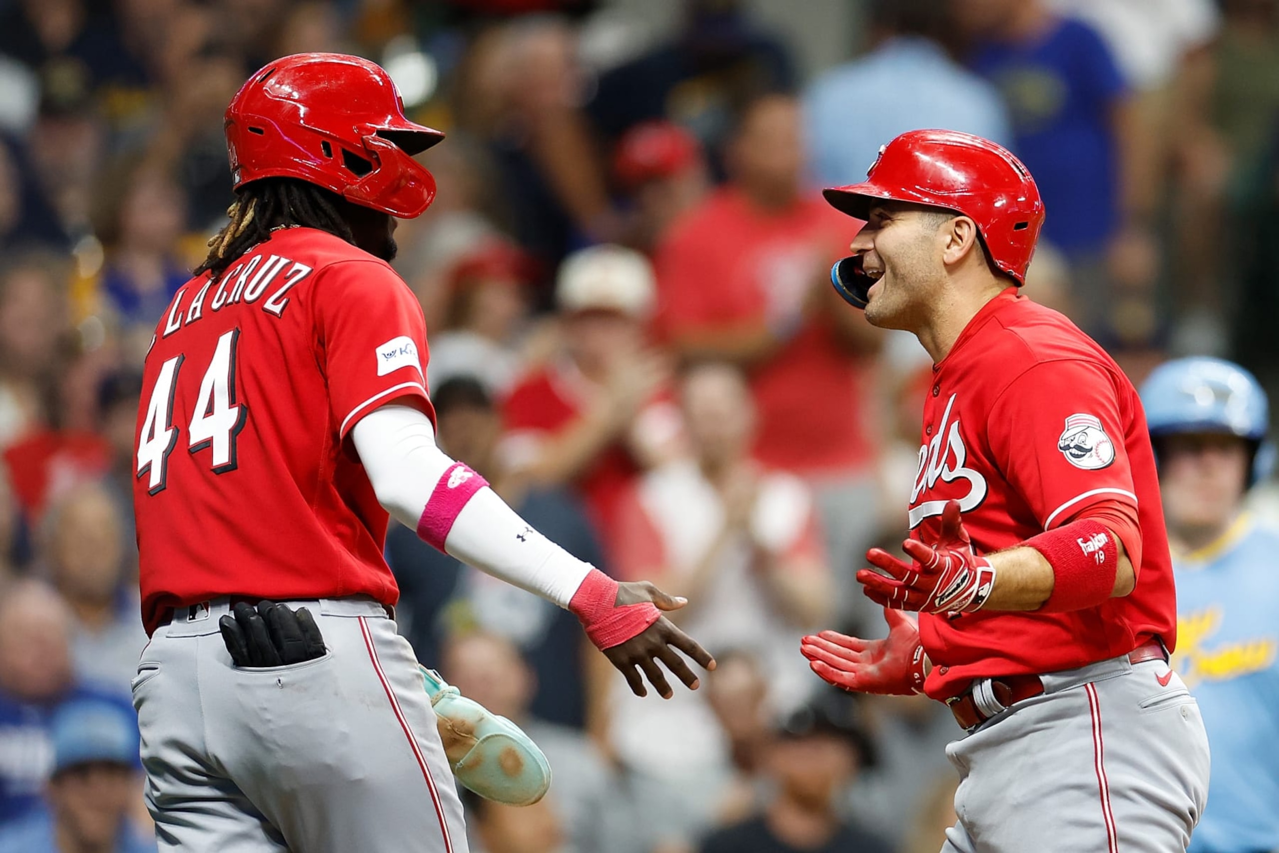 Elly De La Cruz (L) and Joey Votto (R)