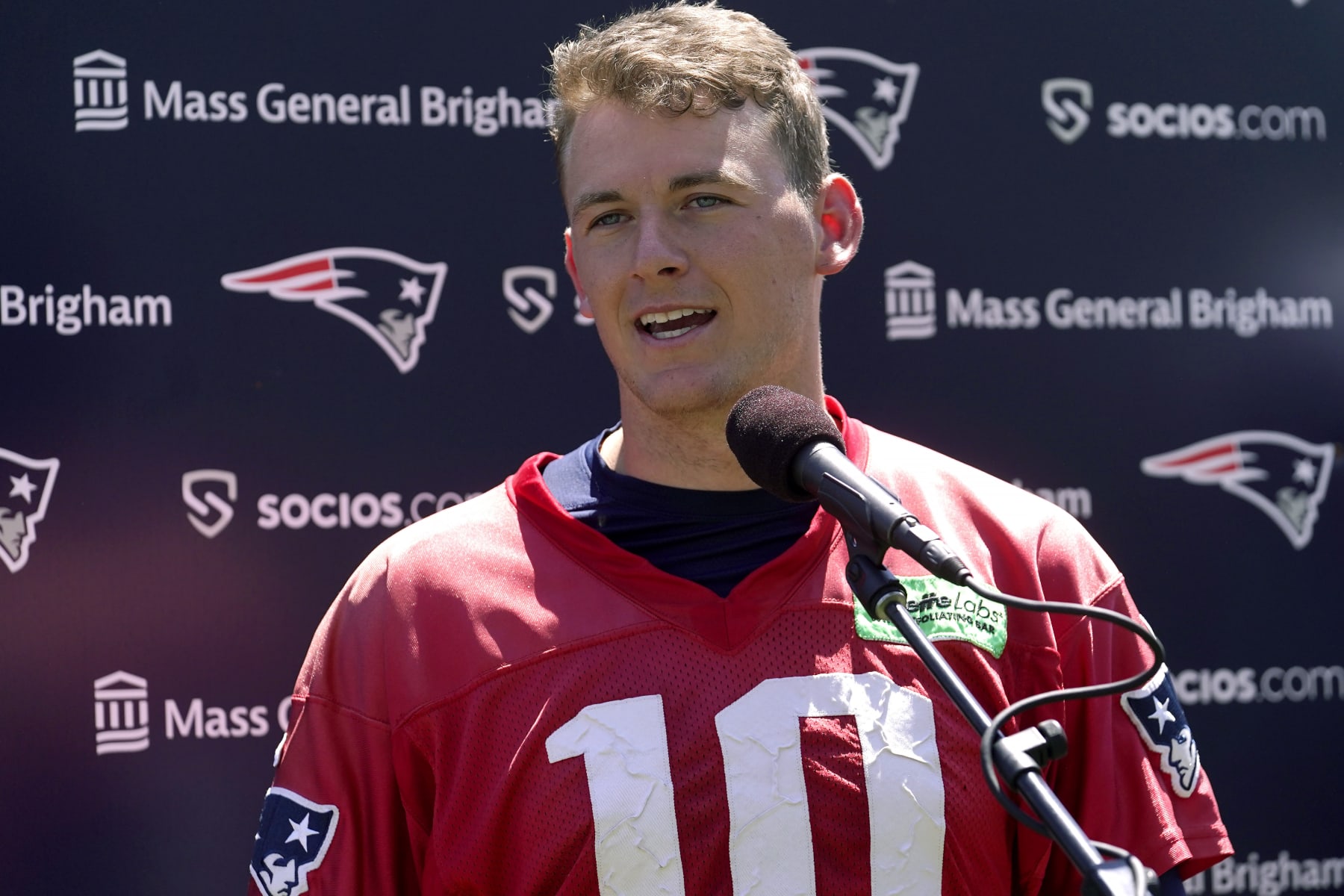 New England Patriots quarterback Mac Jones speaks with reporters following an NFL football offseason workout, Wednesday, May 31, 2023, in Foxborough, Mass. (AP Photo/Steven Senne) New England Patriots quarterback Mac Jones speaks with reporters following an NFL football offseason workout, Wednesday, May 31, 2023, in Foxborough, Mass. (AP Photo/Steven Senne)