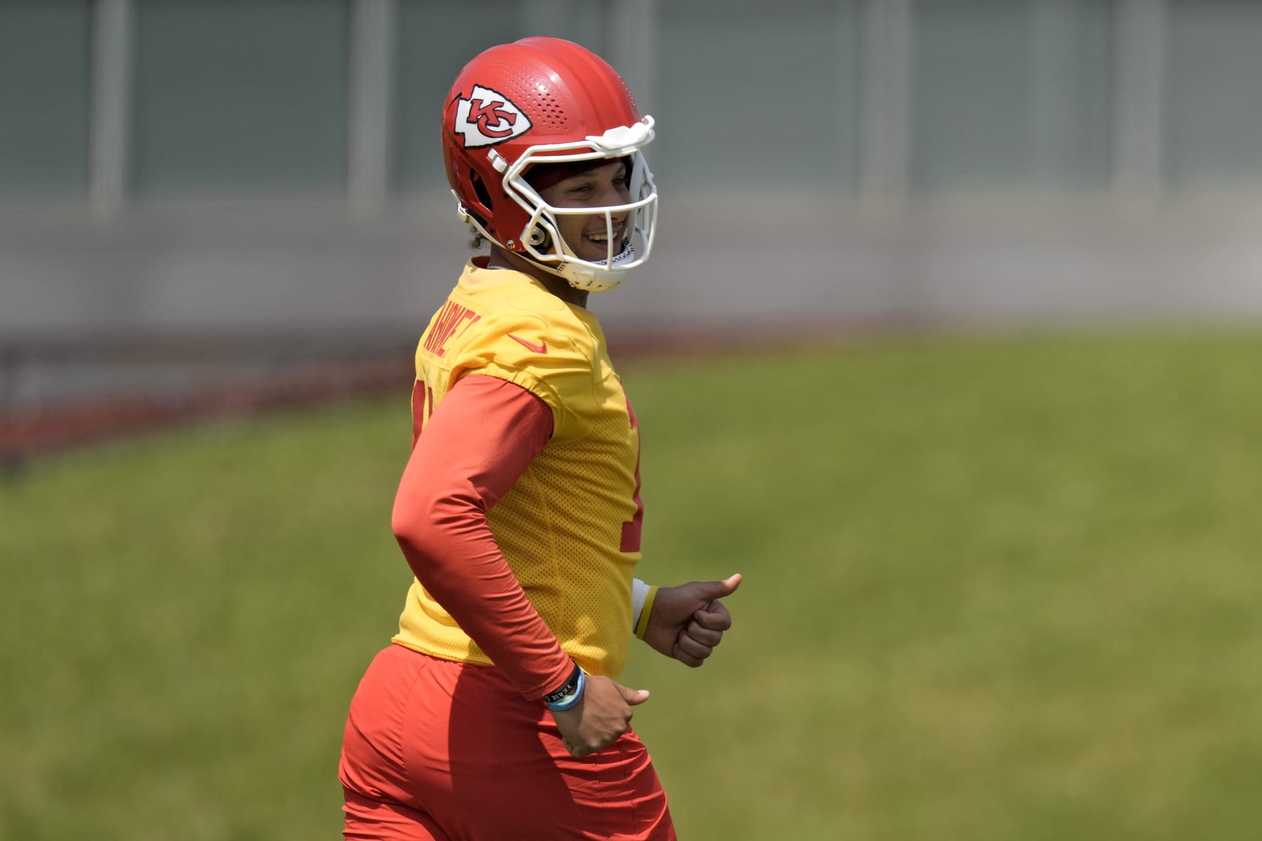 Kansas City Chiefs quarterback Patrick Mahomes (15) runs during the NFL football team's organized team activities Wednesday, May 24, 2023, in Kansas City, Mo. (AP Photo/Charlie Riedel)