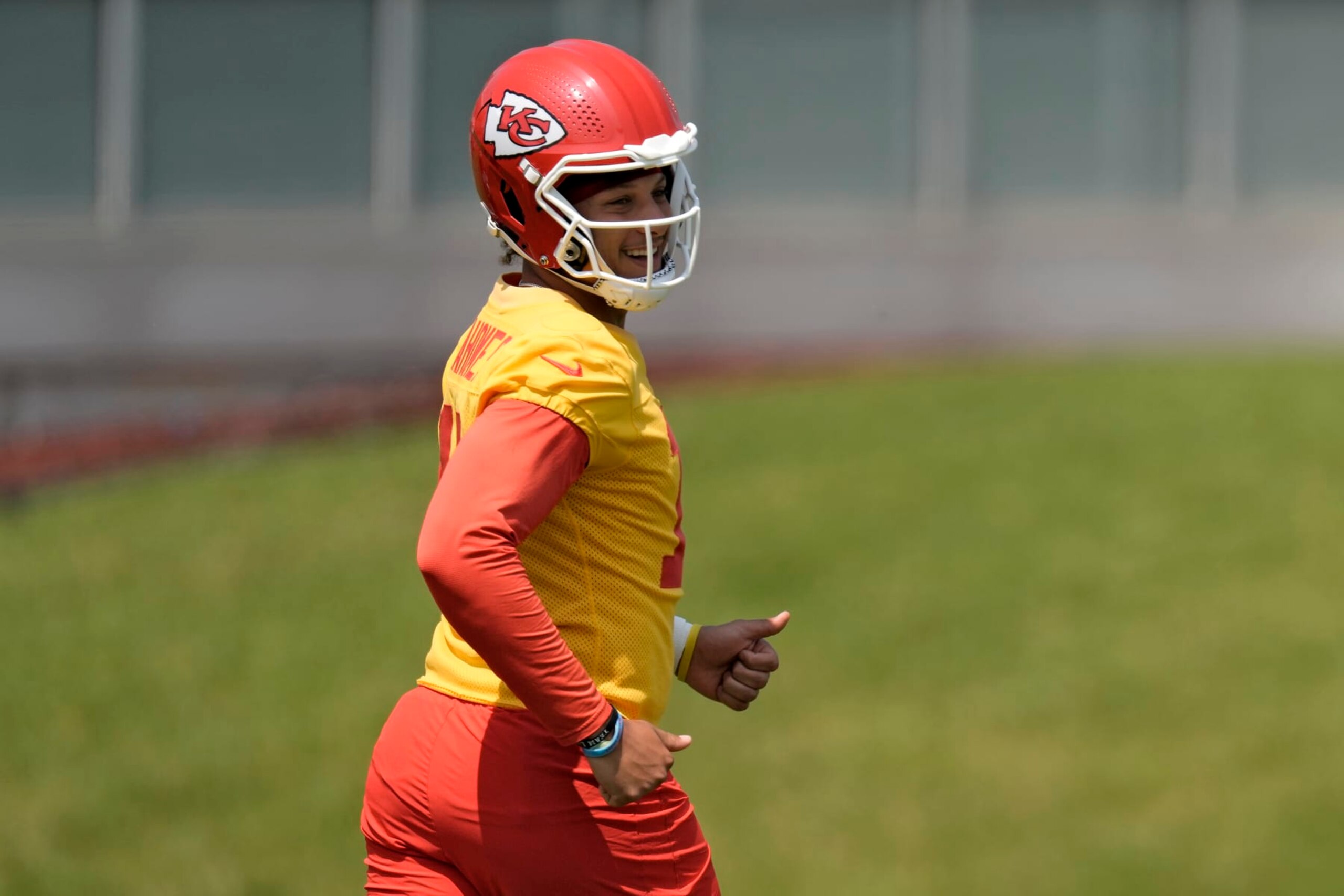 Kansas City Chiefs quarterback Patrick Mahomes (15) runs during the NFL football team's organized team activities Wednesday, May 24, 2023, in Kansas City, Mo. (AP Photo/Charlie Riedel)
