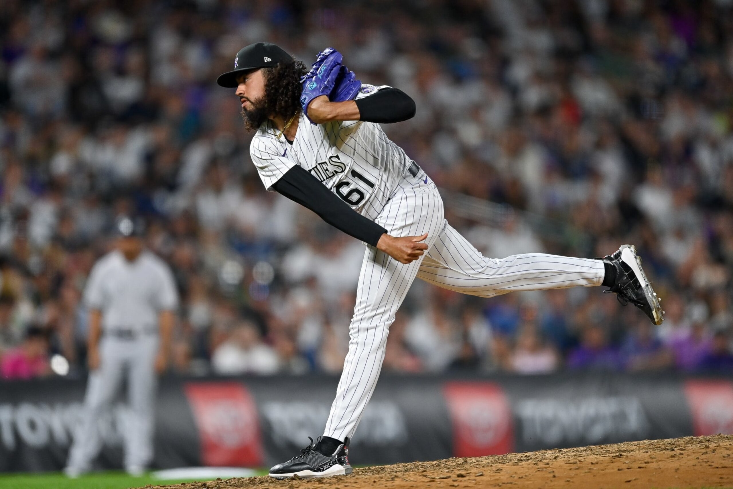 DENVER, CO - JULY 14: Justin Lawrence #61 of the Colorado Rockies pitches in the ninth inning of a game against the New York Yankees at Coors Field on July 14, 2023 in Denver, Colorado. (Photo by Dustin Bradford/Getty Images)