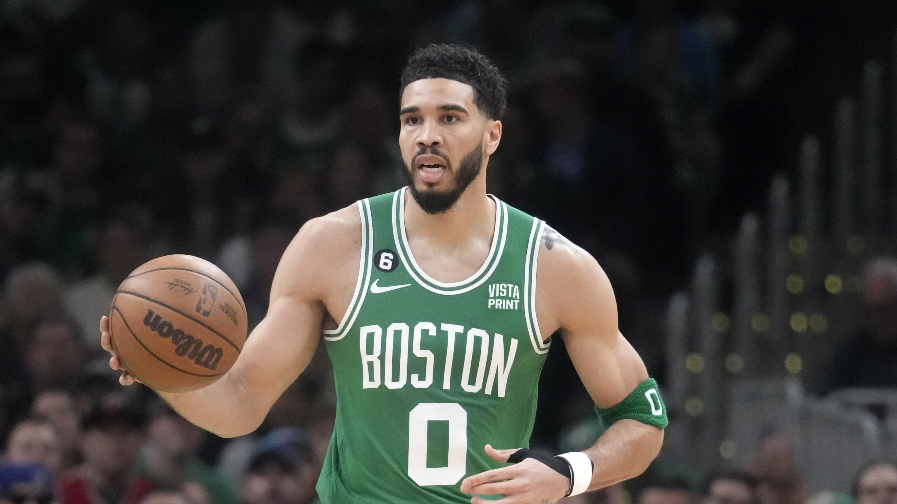 Boston Celtics forward Jayson Tatum dribbles during the first half in Game 5 of the NBA basketball Eastern Conference finals against the Miami Heat Thursday, May 25, 2023, in Boston. (AP Photo/Charles Krupa )