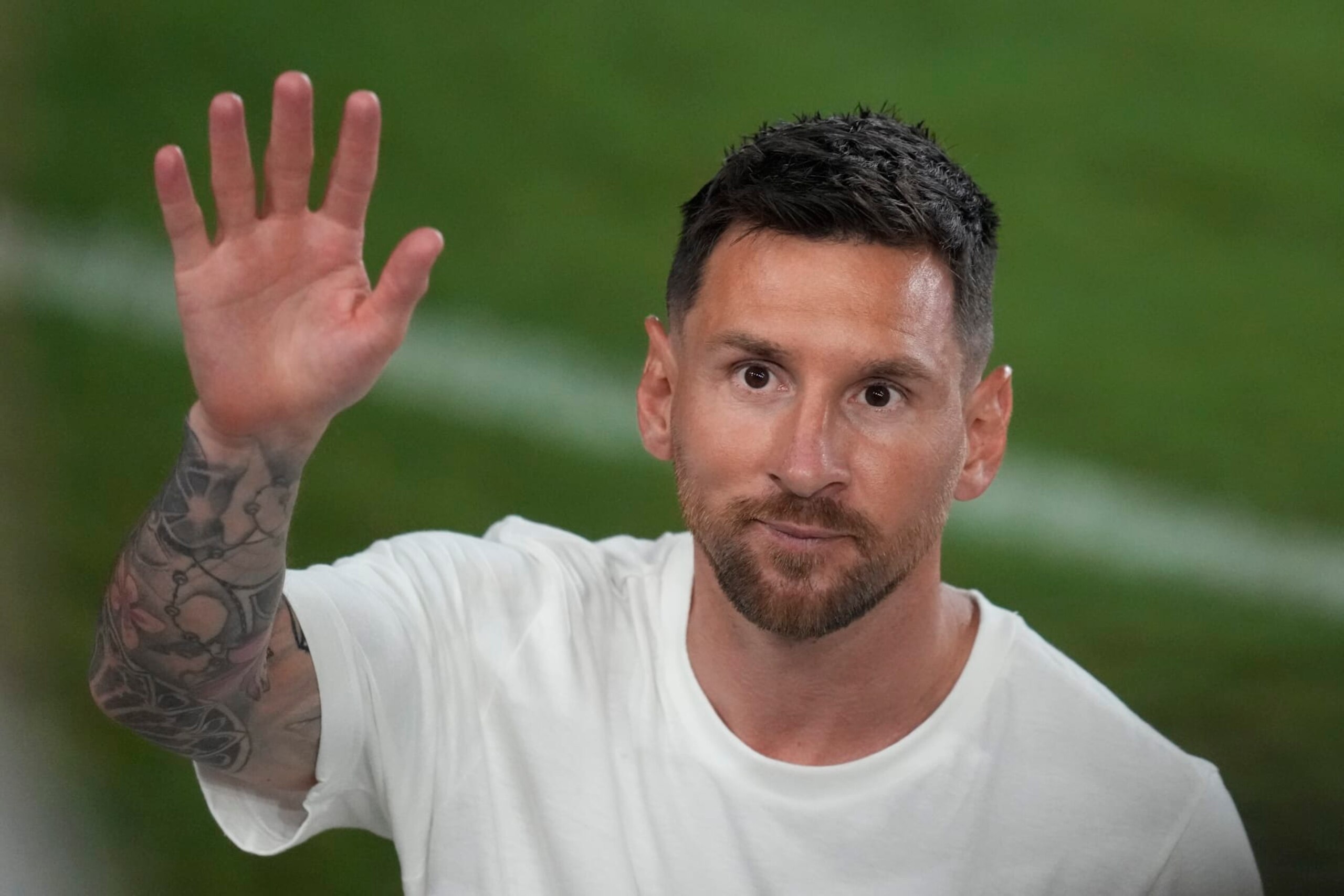 International soccer superstar Lionel Messi waves as he leaves following a celebration to present him to fans one day after his signing with the Inter Miami MLS soccer team, Sunday, July 16, 2023, in Fort Lauderdale, Fla. (AP Photo/Rebecca Blackwell)