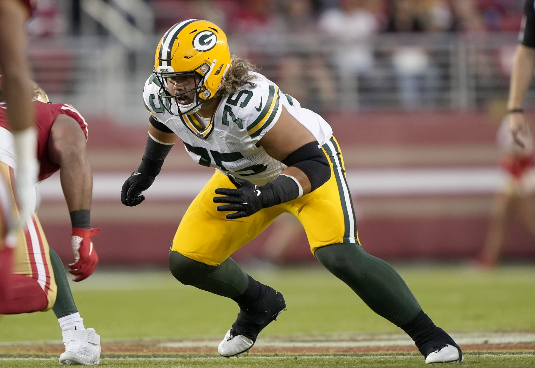 SANTA CLARA, CALIFORNIA - AUGUST 12: Sean Rhyan #75 of the Green Bay Packers blocks against the San Francisco 49ers during the fourth quarter of an NFL preseason football game at Levi's Stadium on August 12, 2022 in Santa Clara, California. (Photo by Thearon W. Henderson/Getty Images)
