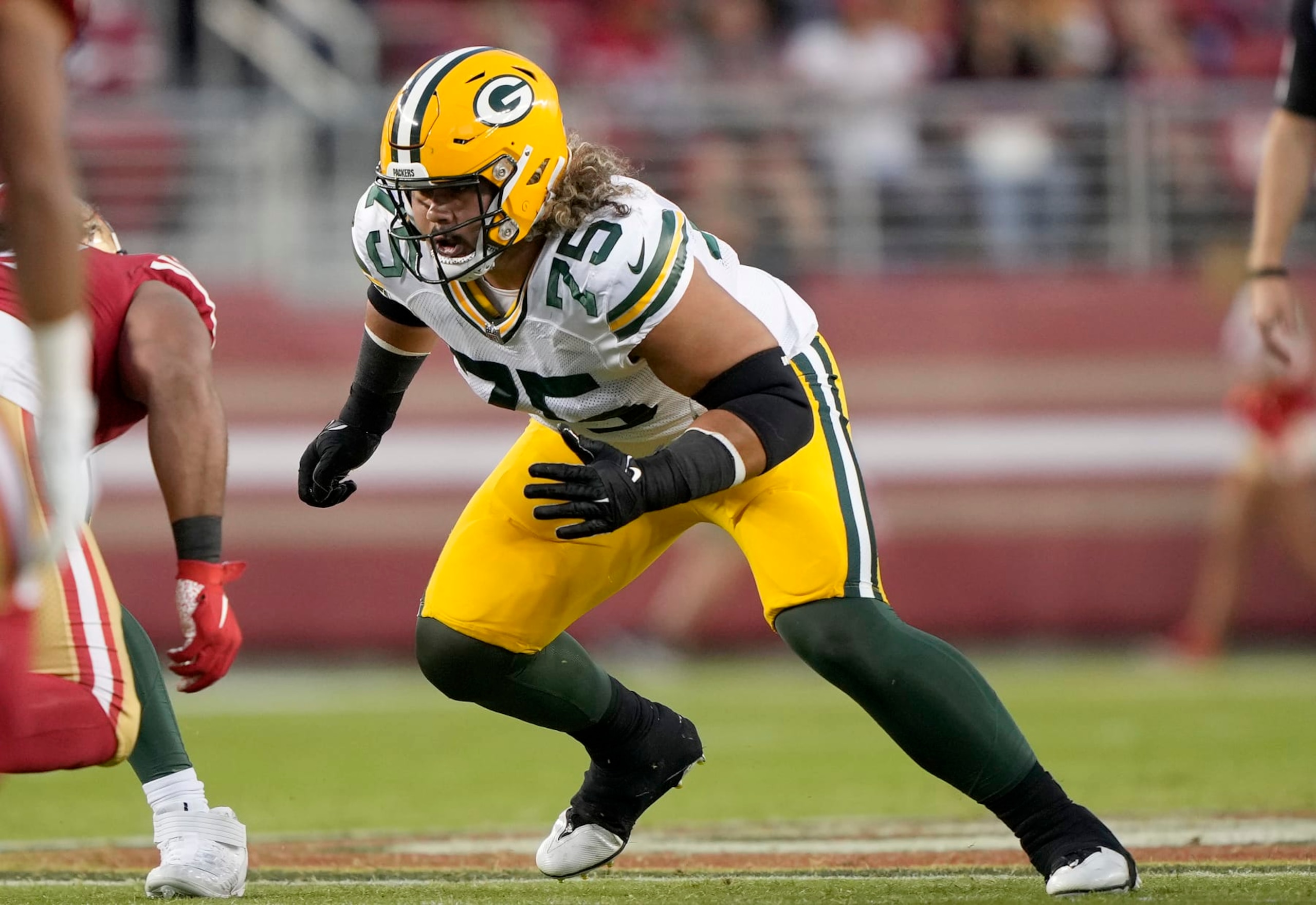 SANTA CLARA, CALIFORNIA - AUGUST 12: Sean Rhyan #75 of the Green Bay Packers blocks against the San Francisco 49ers during the fourth quarter of an NFL preseason football game at Levi's Stadium on August 12, 2022 in Santa Clara, California. (Photo by Thearon W. Henderson/Getty Images)