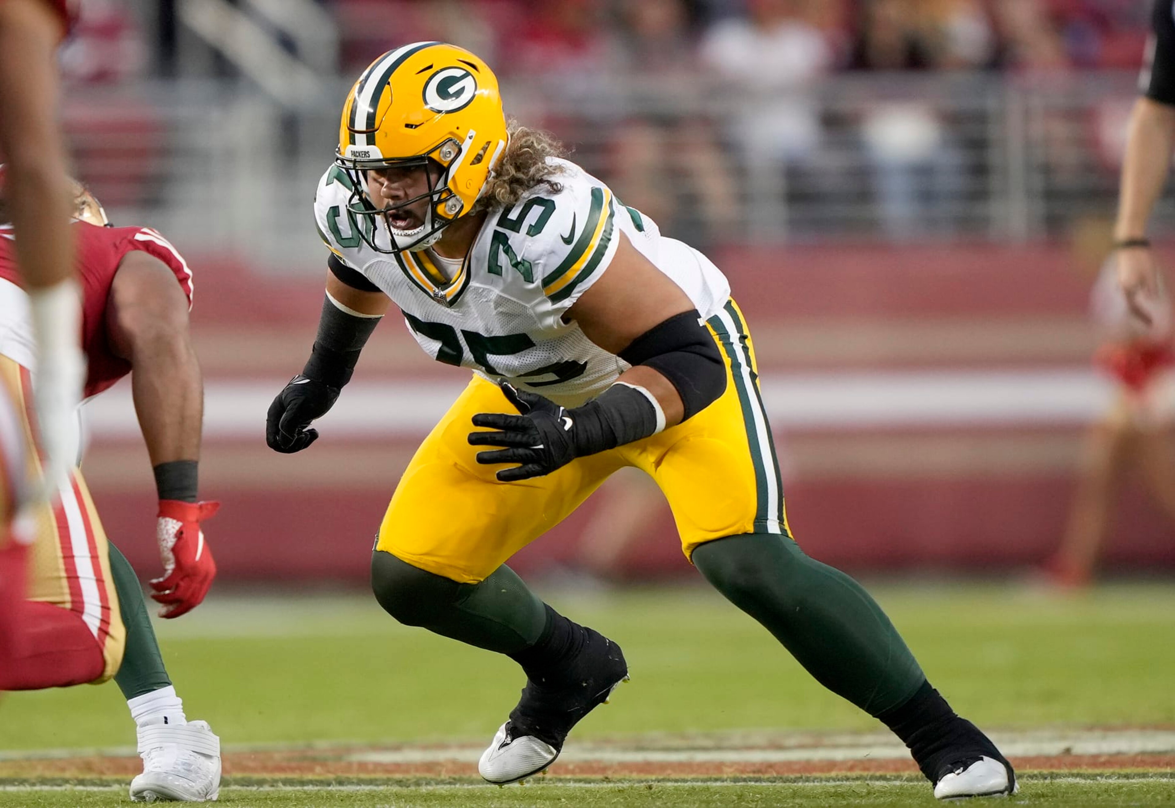 SANTA CLARA, CALIFORNIA - AUGUST 12: Sean Rhyan #75 of the Green Bay Packers blocks against the San Francisco 49ers during the fourth quarter of an NFL preseason football game at Levi's Stadium on August 12, 2022 in Santa Clara, California. (Photo by Thearon W. Henderson/Getty Images) SANTA CLARA, CALIFORNIA - AUGUST 12: Sean Rhyan #75 of the Green Bay Packers blocks against the San Francisco 49ers during the fourth quarter of an NFL preseason football game at Levi's Stadium on August 12, 2022 in Santa Clara, California. (Photo by Thearon W. Henderson/Getty Images)