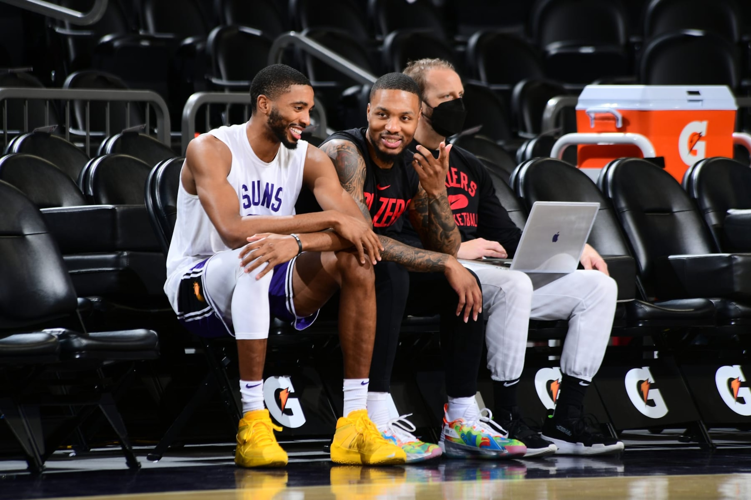 PHOENIX, AZ - NOVEMBER 10: Mikal Bridges #25 of the Phoenix Suns and Damian Lillard #0 of the Portland Trail Blazers share a conversation before the game on November 10, 2021 at Footprint Center in Phoenix, Arizona. NOTE TO USER: User expressly acknowledges and agrees that, by downloading and or using this photograph, user is consenting to the terms and conditions of the Getty Images License Agreement. Mandatory Copyright Notice: Copyright 2021 NBAE (Photo by Michael Gonzales/NBAE via Getty Images) PHOENIX, AZ - NOVEMBER 10: Mikal Bridges #25 of the Phoenix Suns and Damian Lillard #0 of the Portland Trail Blazers share a conversation before the game on November 10, 2021 at Footprint Center in Phoenix, Arizona. NOTE TO USER: User expressly acknowledges and agrees that, by downloading and or using this photograph, user is consenting to the terms and conditions of the Getty Images License Agreement. Mandatory Copyright Notice: Copyright 2021 NBAE (Photo by Michael Gonzales/NBAE via Getty Images)