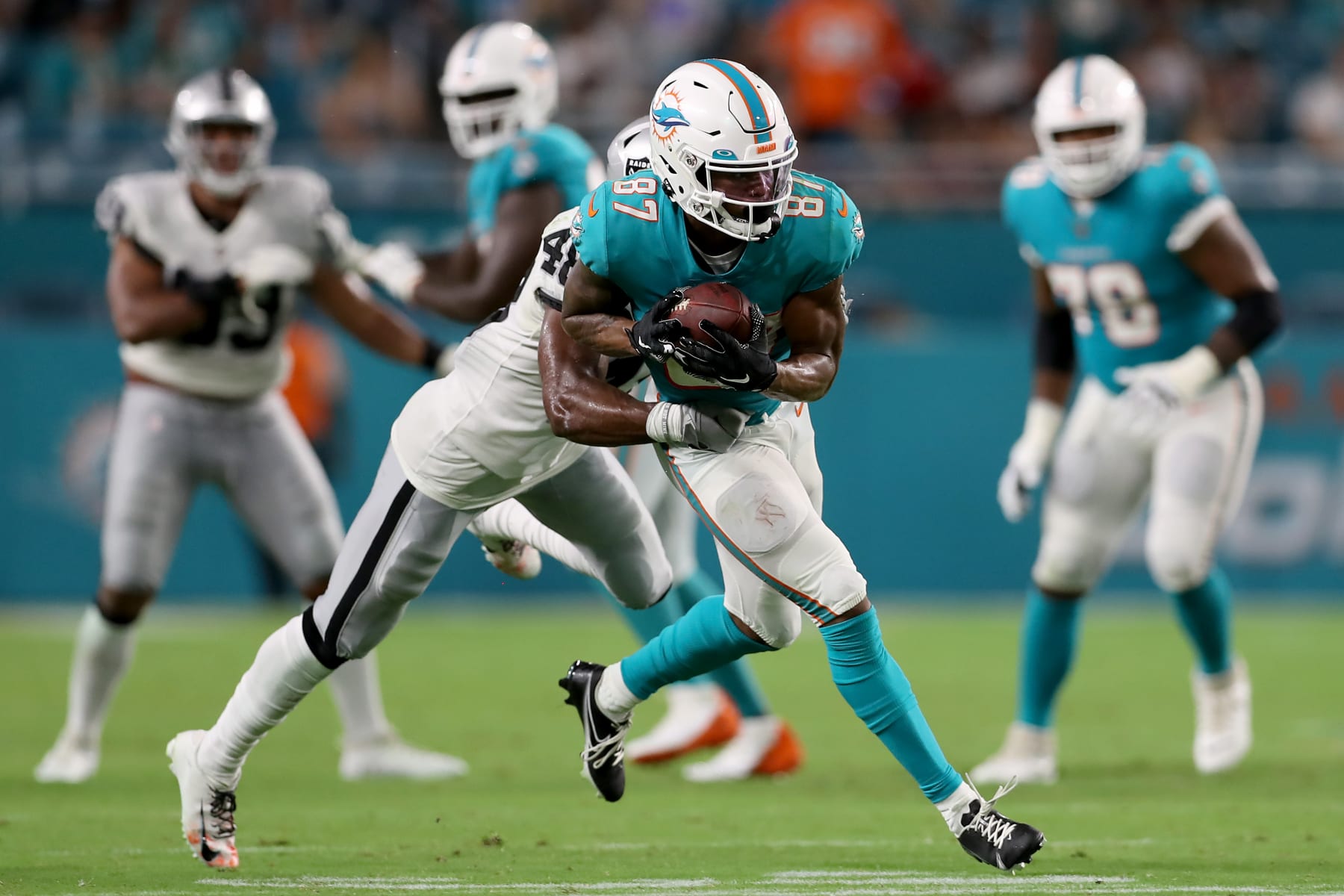 MIAMI GARDENS, FLORIDA - AUGUST 20: Erik Ezukanma #87 of the Miami Dolphins catches a pass during the fourth quarter against the Las Vegas Raiders at Hard Rock Stadium on August 20, 2022 in Miami Gardens, Florida. (Photo by Megan Briggs/Getty Images)