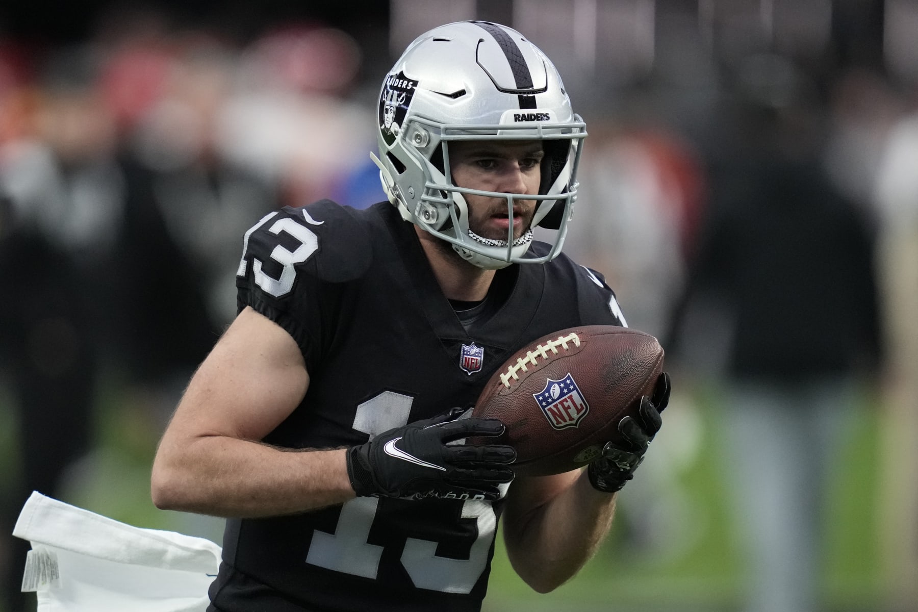 Las Vegas Raiders wide receiver Hunter Renfrow (13) warms up before an NFL football game against the Kansas City Chiefs, Wednesday, Jan. 11, 2023, in Las Vegas. (AP Photo/John Locher)