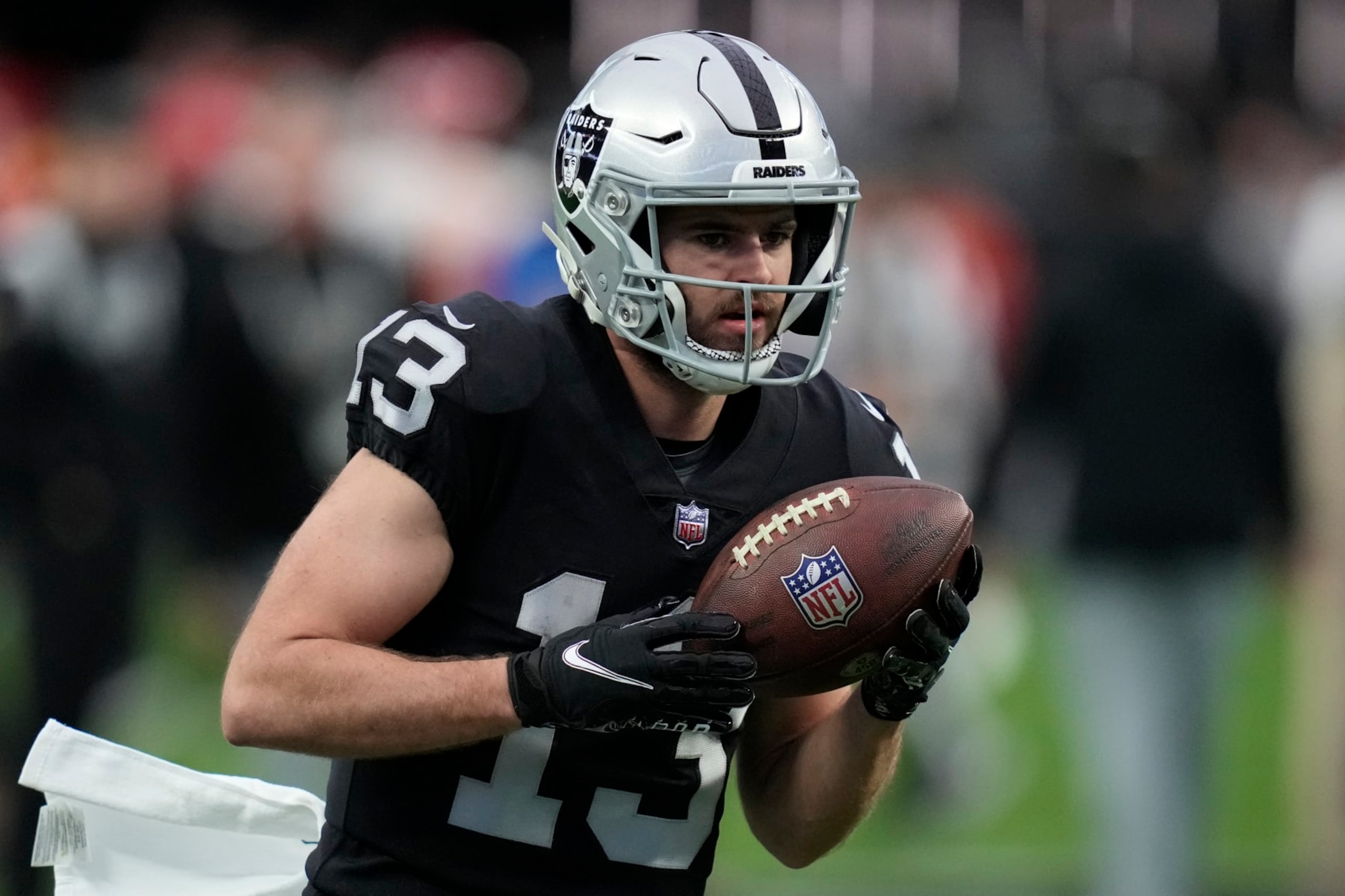 Las Vegas Raiders wide receiver Hunter Renfrow (13) warms up before an NFL football game against the Kansas City Chiefs, Wednesday, Jan. 11, 2023, in Las Vegas. (AP Photo/John Locher)