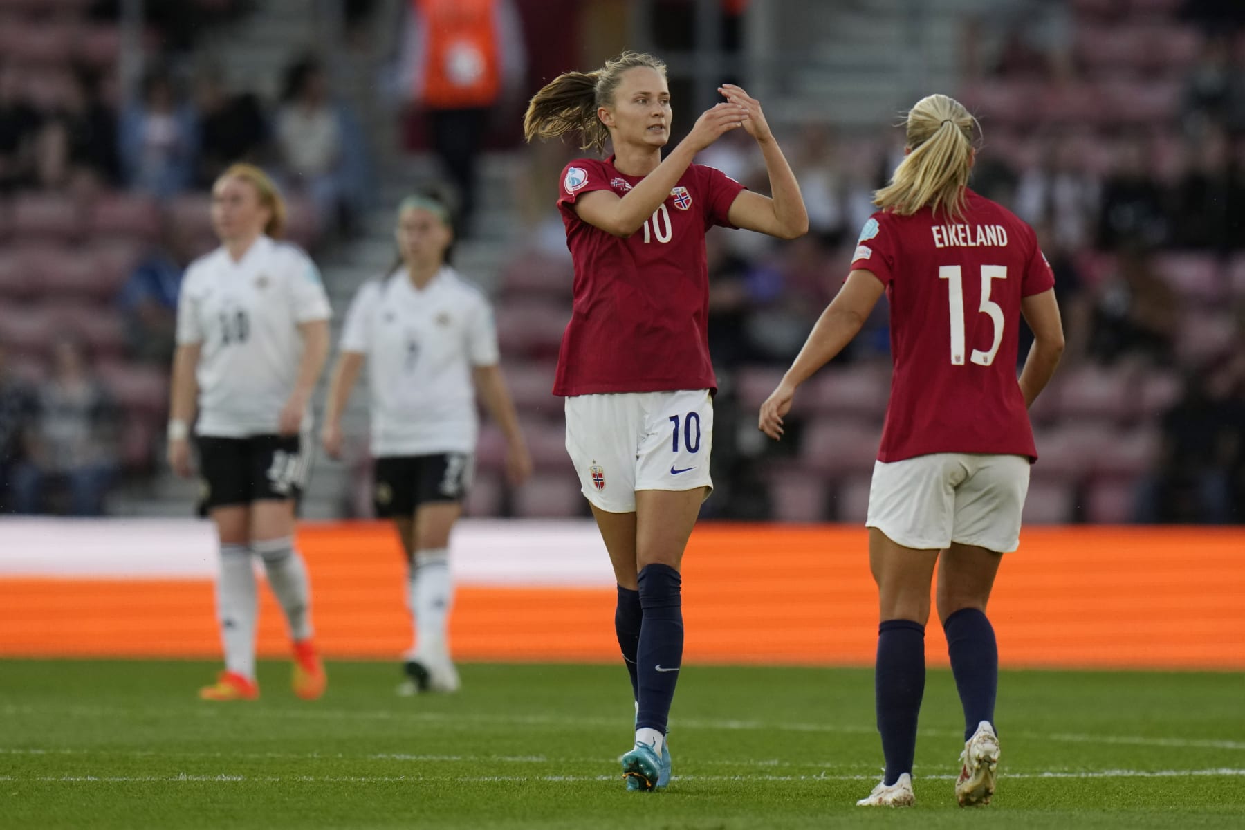 Norway's Caroline Graham Hansen, left, celebrates with her teammate Amalie Eikeland after scoring her side's third goal during the Women Euro 2022 soccer match between Norway and Northern Ireland, at the St.Mary's stadium, in Southampton, Thursday, July 7, 2022. (AP Photo/Alessandra Tarantino)