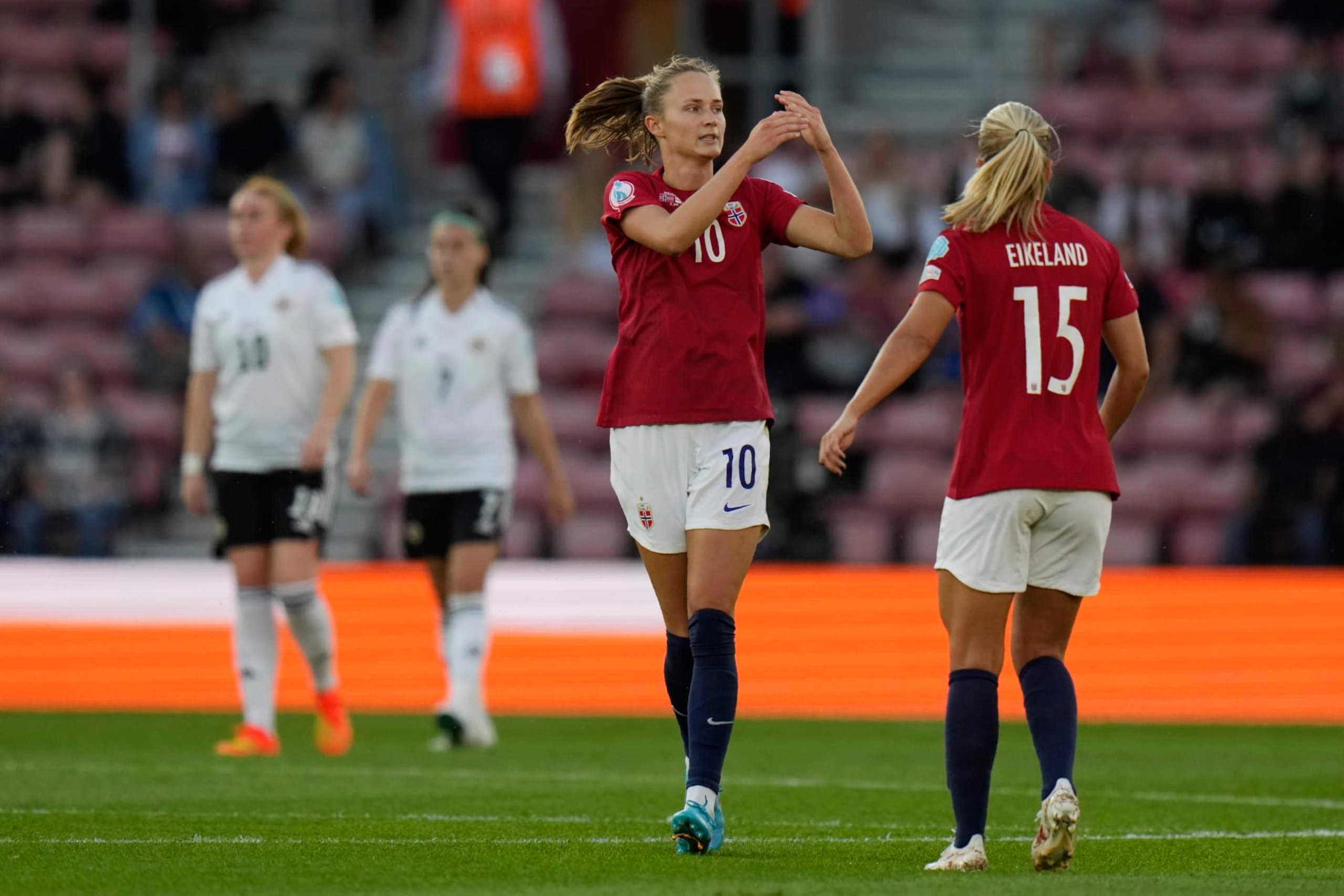 Norway's Caroline Graham Hansen, left, celebrates with her teammate Amalie Eikeland after scoring her side's third goal during the Women Euro 2022 soccer match between Norway and Northern Ireland, at the St.Mary's stadium, in Southampton, Thursday, July 7, 2022. (AP Photo/Alessandra Tarantino)