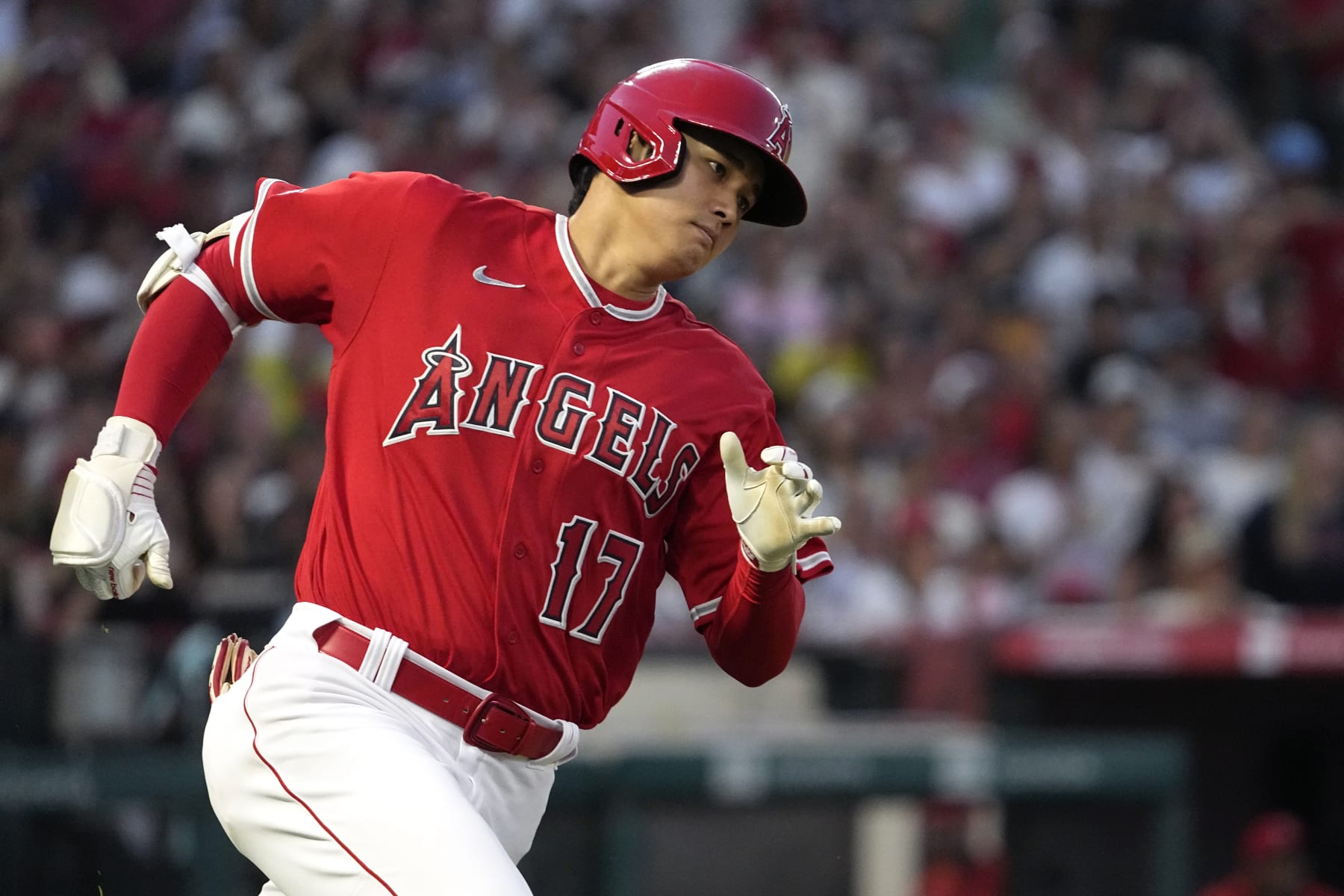 Los Angeles Angels' Shohei Ohtani rounds first on his way to a triple during the fifth inning of a baseball game against the New York Yankees Tuesday, July 18, 2023, in Anaheim, Calif. (AP Photo/Mark J. Terrill)