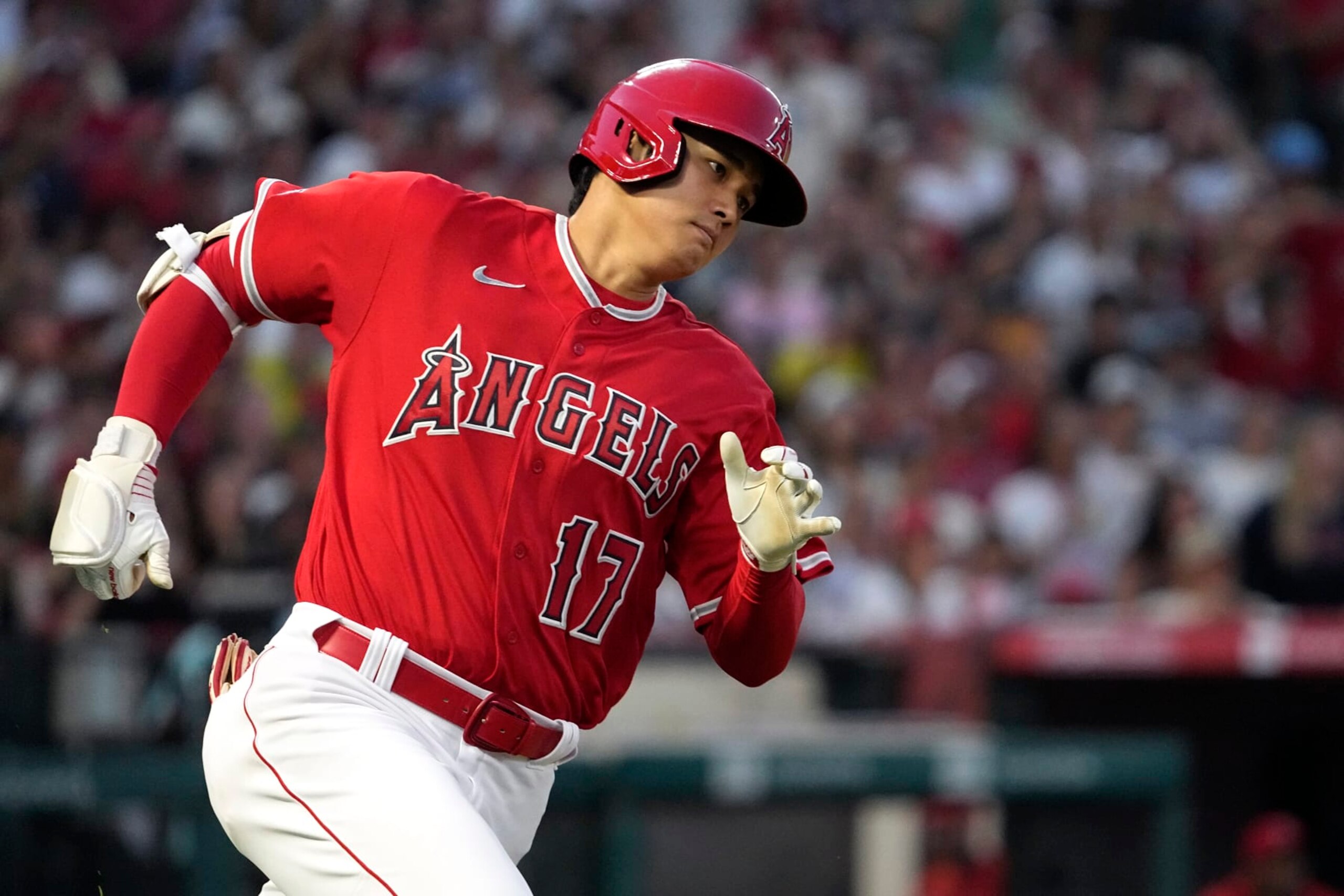 Los Angeles Angels' Shohei Ohtani rounds first on his way to a triple during the fifth inning of a baseball game against the New York Yankees Tuesday, July 18, 2023, in Anaheim, Calif. (AP Photo/Mark J. Terrill)