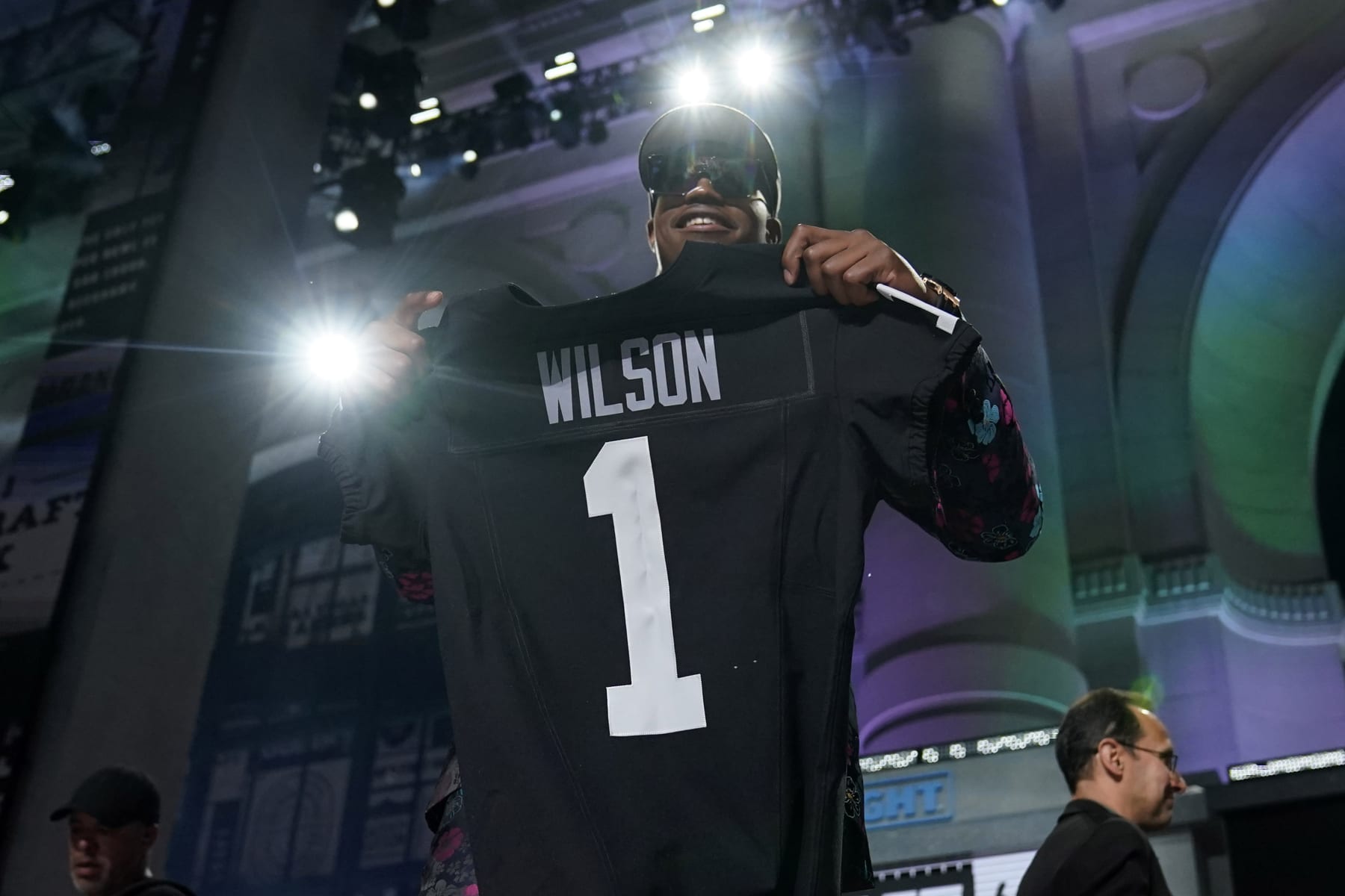 Texas Tech defensive lineman Tyree Wilson stands on stage after being chosen by the Las Vegas Raiders with the seventh overall pick during the first round of the NFL football draft, Thursday, April 27, 2023, in Kansas City, Mo. (AP Photo/Jeff Roberson)
