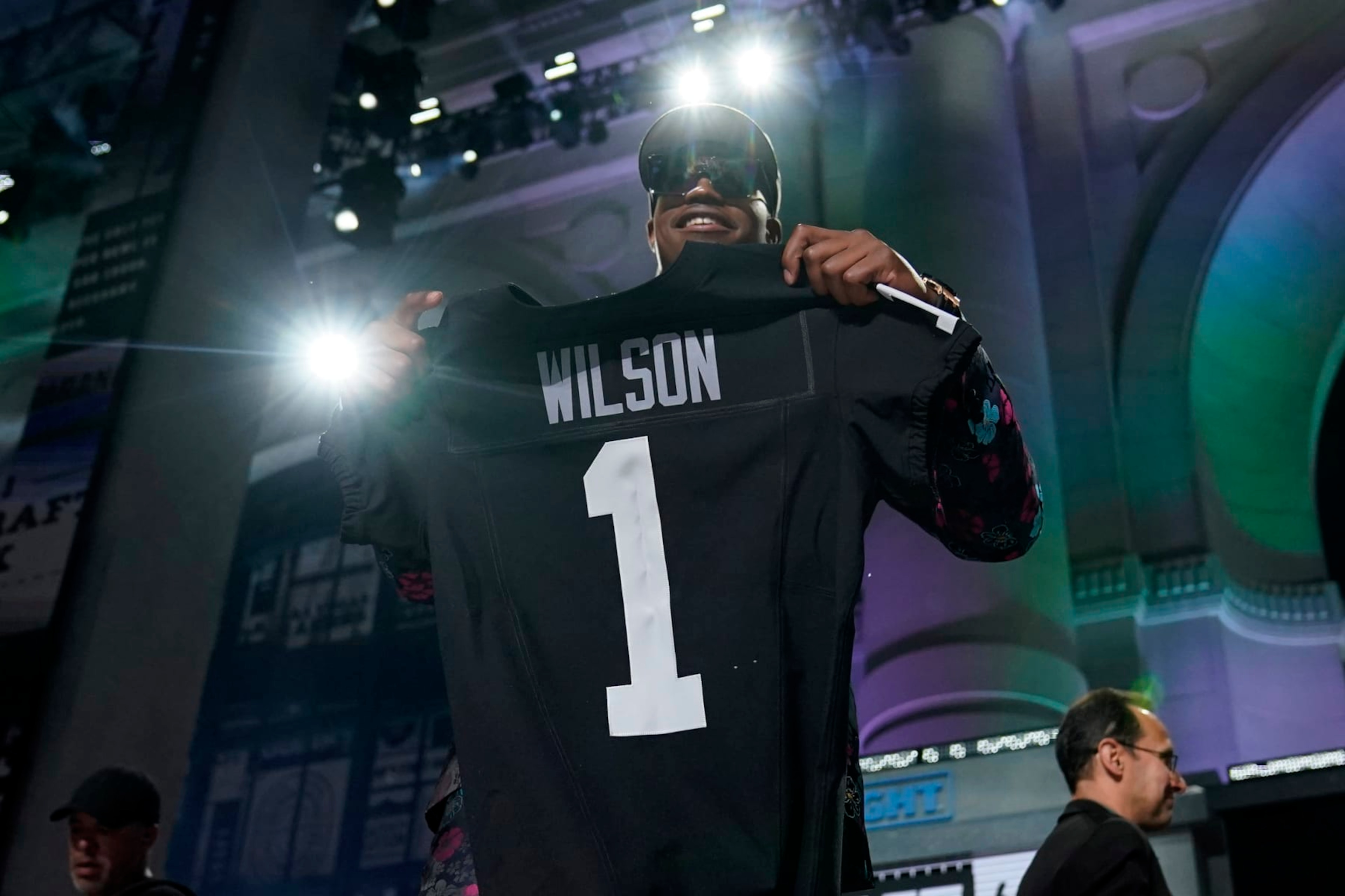 Texas Tech defensive lineman Tyree Wilson stands on stage after being chosen by the Las Vegas Raiders with the seventh overall pick during the first round of the NFL football draft, Thursday, April 27, 2023, in Kansas City, Mo. (AP Photo/Jeff Roberson) Texas Tech defensive lineman Tyree Wilson stands on stage after being chosen by the Las Vegas Raiders with the seventh overall pick during the first round of the NFL football draft, Thursday, April 27, 2023, in Kansas City, Mo. (AP Photo/Jeff Roberson)