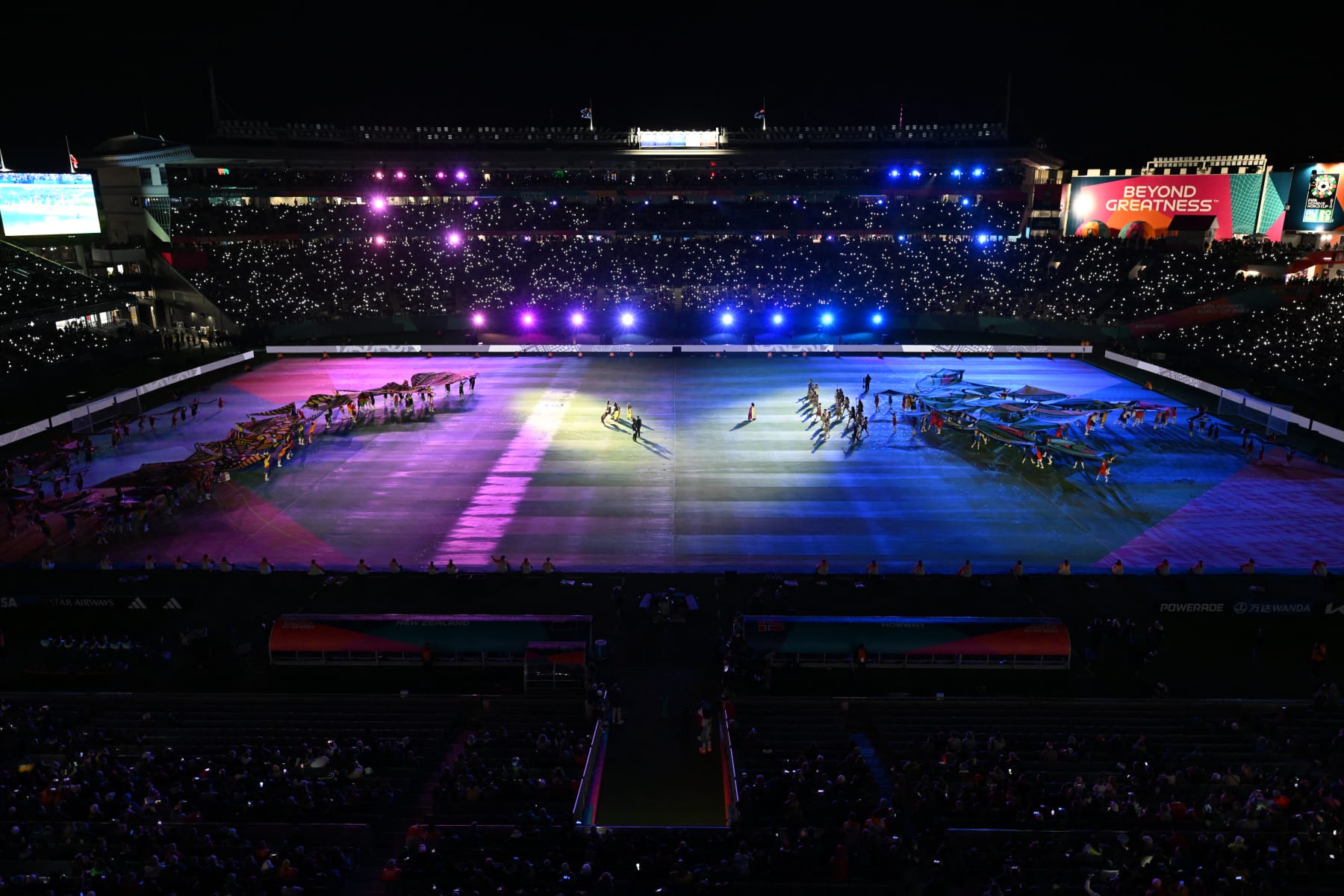 Performers create a rainbow serpent (L) and a whai (R), or sting ray, designed with Maori and First Nation artists, during the opening ceremony ahead of the Australia and New Zealand 2023 Women's World Cup Group A football match between New Zealand and Norway at Eden Park in Auckland on July 20, 2023. (Photo by Saeed KHAN / AFP) (Photo by SAEED KHAN/AFP via Getty Images)