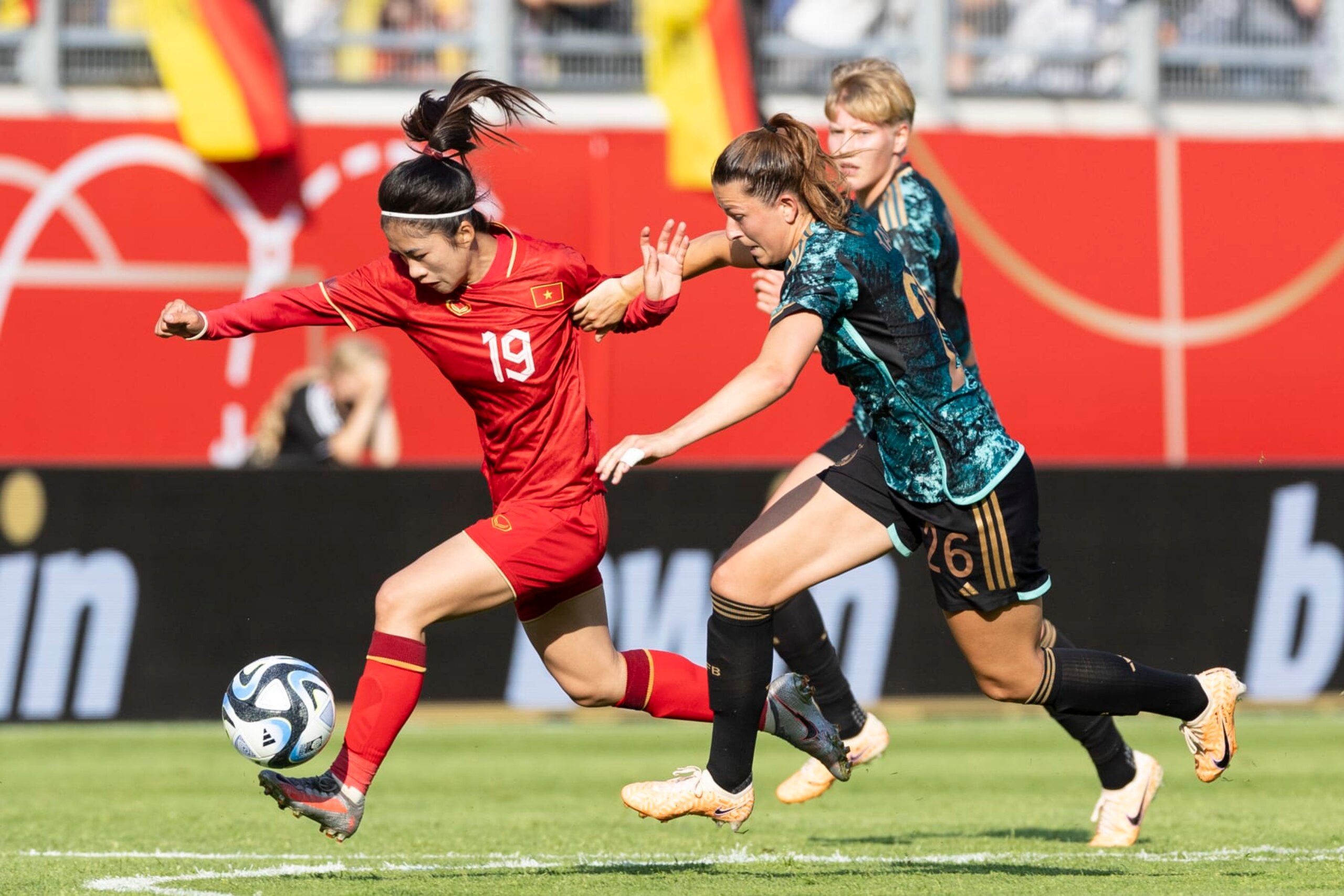 OFFENBACH, GERMANY - JUNE 24: Nha Nguyen Thi Thanh of Vietnam and Chantal Hagel of Germany battle for the ball during the Women's international friendly between Germany and Vietnam at Stadion Am Bieberer Berg on June 24, 2023 in Offenbach, Germany. (Photo by Marco Steinbrenner/DeFodi Images via Getty Images)