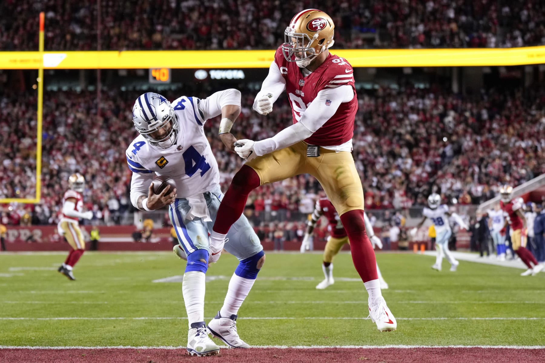 SANTA CLARA, CALIFORNIA - JANUARY 22: Arik Armstead #91 of the San Francisco 49ers pressures Dak Prescott #4 of the Dallas Cowboys during the fourth quarter of the game in the NFC Divisional Playoff game at Levi's Stadium on January 22, 2023 in Santa Clara, California. (Photo by Thearon W. Henderson/Getty Images)