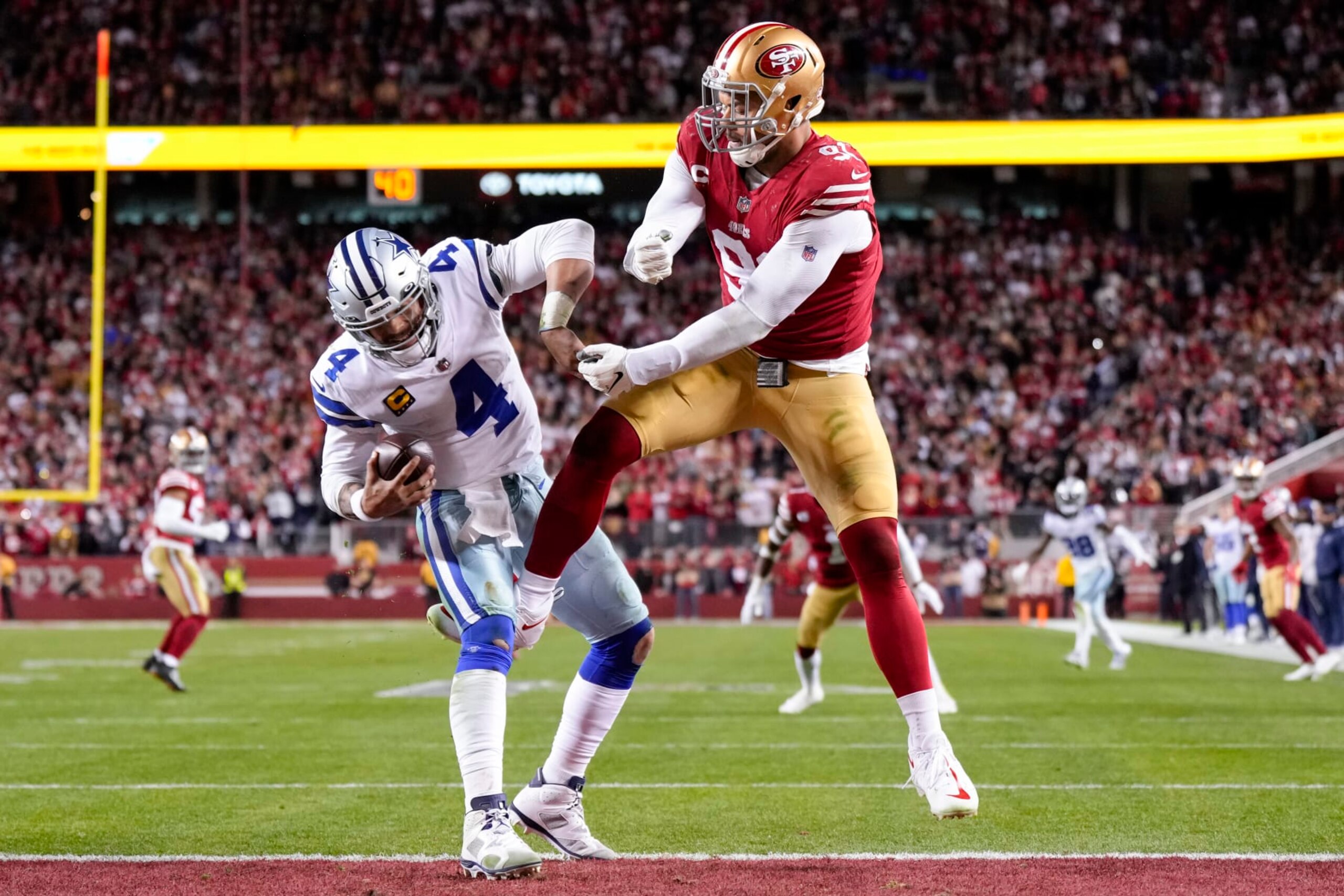 SANTA CLARA, CALIFORNIA - JANUARY 22: Arik Armstead #91 of the San Francisco 49ers pressures Dak Prescott #4 of the Dallas Cowboys during the fourth quarter of the game in the NFC Divisional Playoff game at Levi's Stadium on January 22, 2023 in Santa Clara, California. (Photo by Thearon W. Henderson/Getty Images)