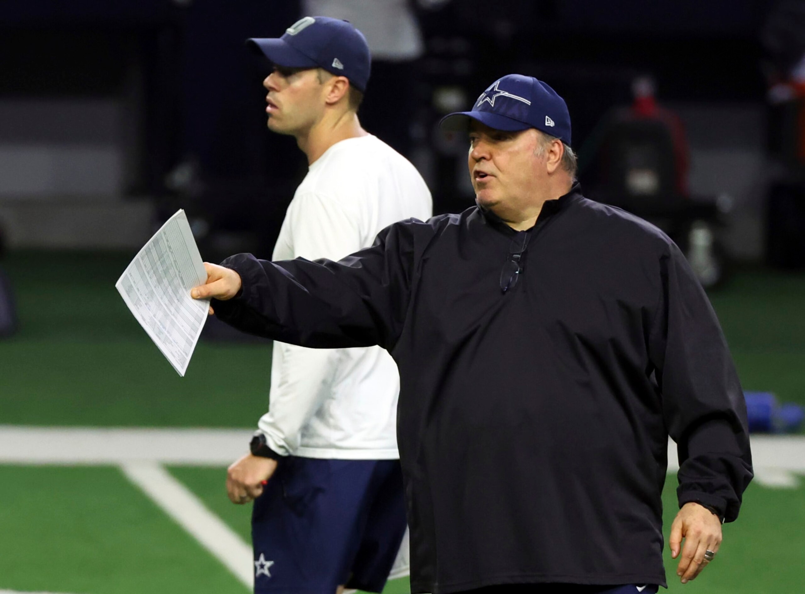 Dallas Cowboys quarterback coach Scott Tolzien, left, and head coach Mike McCarthy watch during an NFL football practice, Tuesday, June 6, 2023, in Frisco, Texas. (AP Photo/Richard W. Rodriguez)