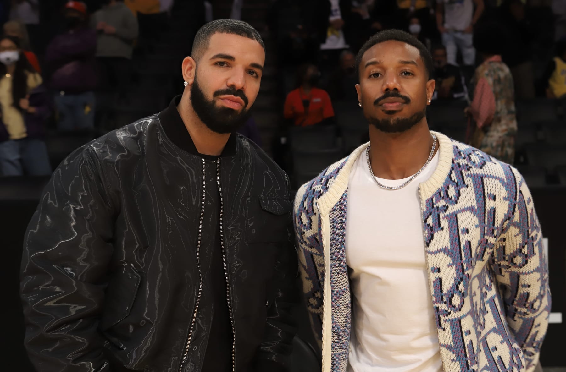 LOS ANGELES, CA - MAY 19:  Rapper, Drake and Actor, Michael B. Jordan look on during the 2021 NBA Play-In Tournament after the game between the Golden State Warriors and Los Angeles Lakers on May 19, 2021 at STAPLES Center in Los Angeles, California. NOTE TO USER: User expressly acknowledges and agrees that, by downloading and/or using this photograph, user is consenting to the terms and conditions of the Getty Images License Agreement.  Mandatory Copyright Notice: Copyright 2021 NBAE (Photo by Jim Poorten/NBAE via Getty Images)