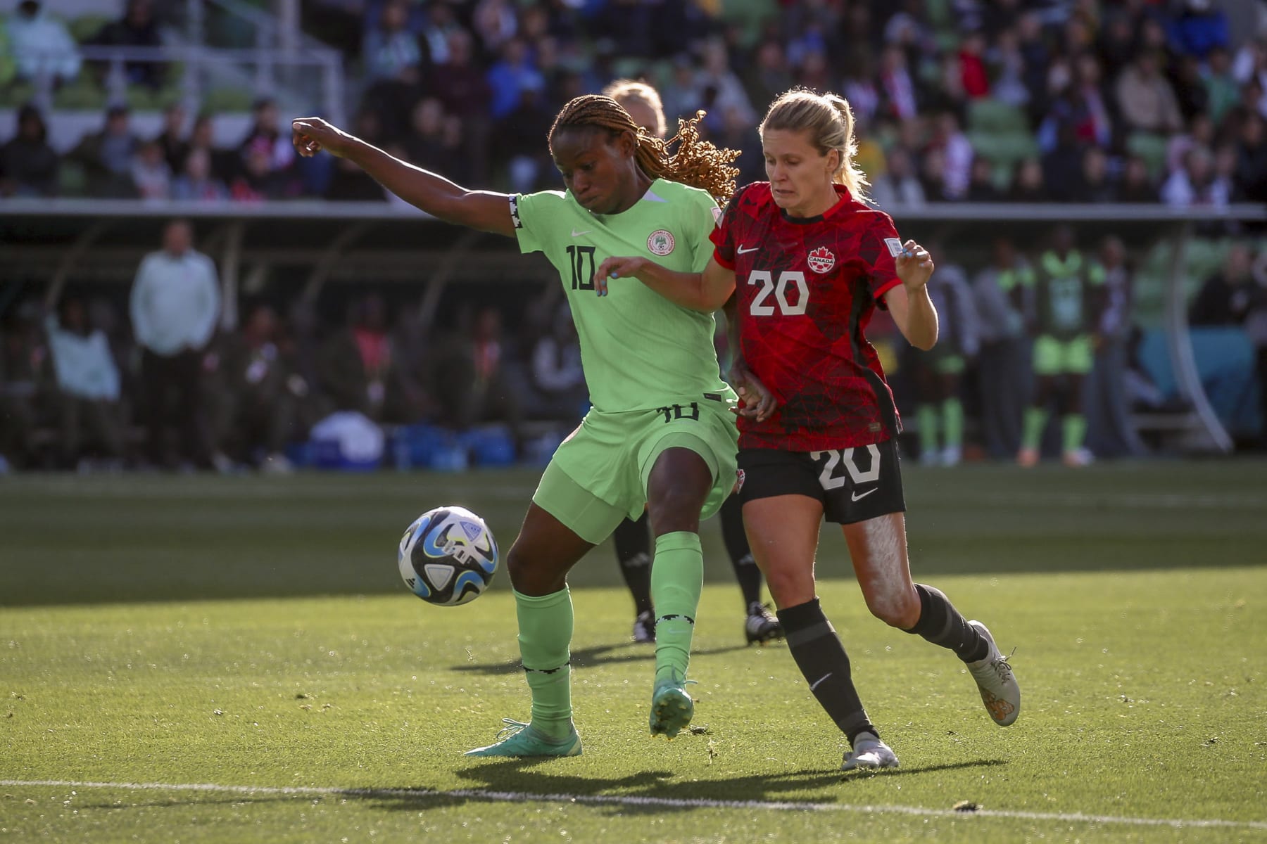 MELBOURNE, AUSTRALIA - JULY 21: Christy Ucheibe of Nigeria, Chloe Lacasse of Canada battle for the ball during the FIFA Women's World Cup Australia & New Zealand 2023 Group B match between Nigeria and Canada at Melbourne Rectangular Stadium on July 21, 2023 in Melbourne, Australia. (Photo by Andrew Wiseman / DeFodi Images via Getty Images)