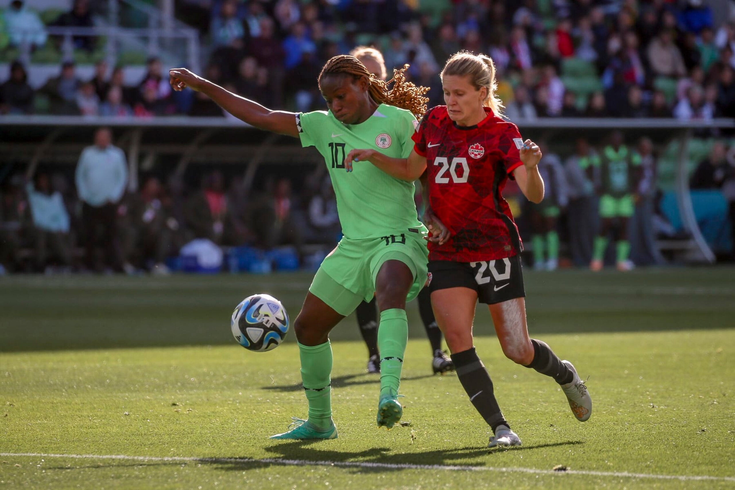 MELBOURNE, AUSTRALIA - JULY 21: Christy Ucheibe of Nigeria, Chloe Lacasse of Canada battle for the ball during the FIFA Women's World Cup Australia & New Zealand 2023 Group B match between Nigeria and Canada at Melbourne Rectangular Stadium on July 21, 2023 in Melbourne, Australia. (Photo by Andrew Wiseman / DeFodi Images via Getty Images)