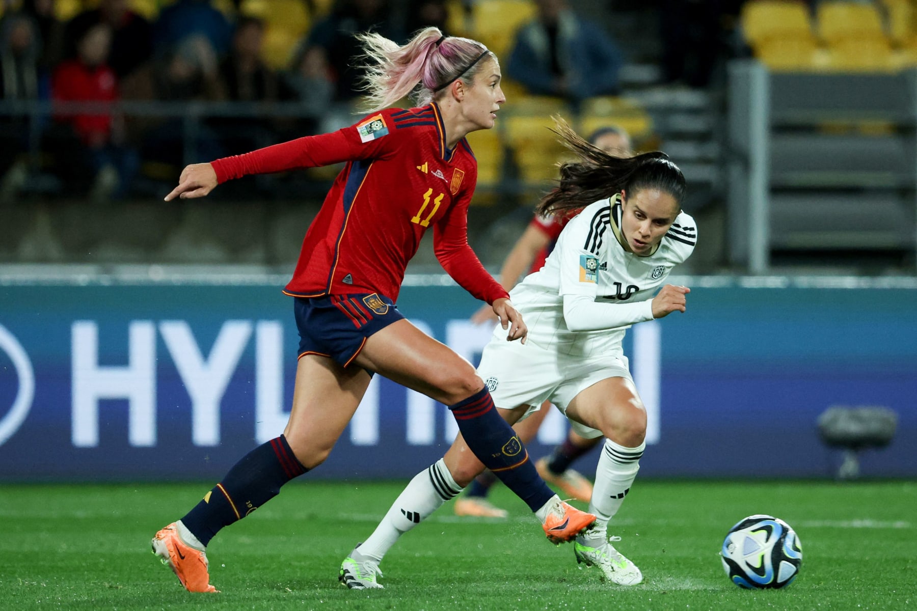 Spain's midfielder #11 Alexia Putellas (L) controls the ball during the Australia and New Zealand 2023 Women's World Cup Group C football match between Spain and Costa Rica at Wellington Stadium, also known as Sky Stadium, in Wellington on July 21, 2023. (Photo by Marty MELVILLE / AFP) (Photo by MARTY MELVILLE/AFP via Getty Images)