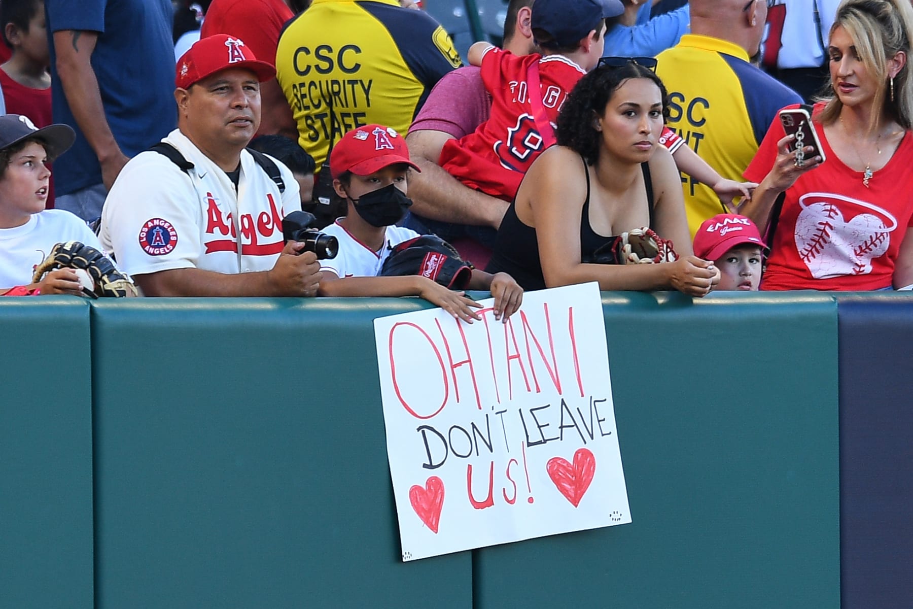 ANAHEIM, CA - JULY 21: A fan holds up a sign for Los Angeles Angels Pitcher Shohei Ohtani (17) potentially leaving the team during the MLB game between the Pittsburgh Pirates and the Los Angeles Angels of Anaheim on July 21, 2023 at Angel Stadium of Anaheim in Anaheim, CA. (Photo by Brian Rothmuller/Icon Sportswire via Getty Images)