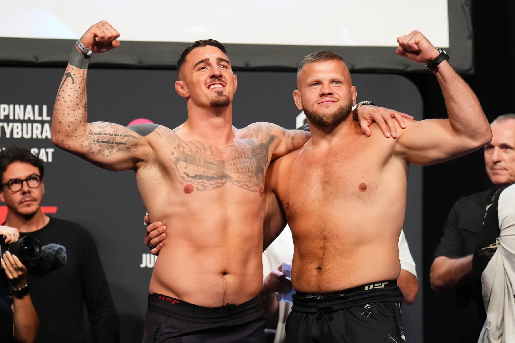 Tom Aspinall (left) and Marcin Tybura