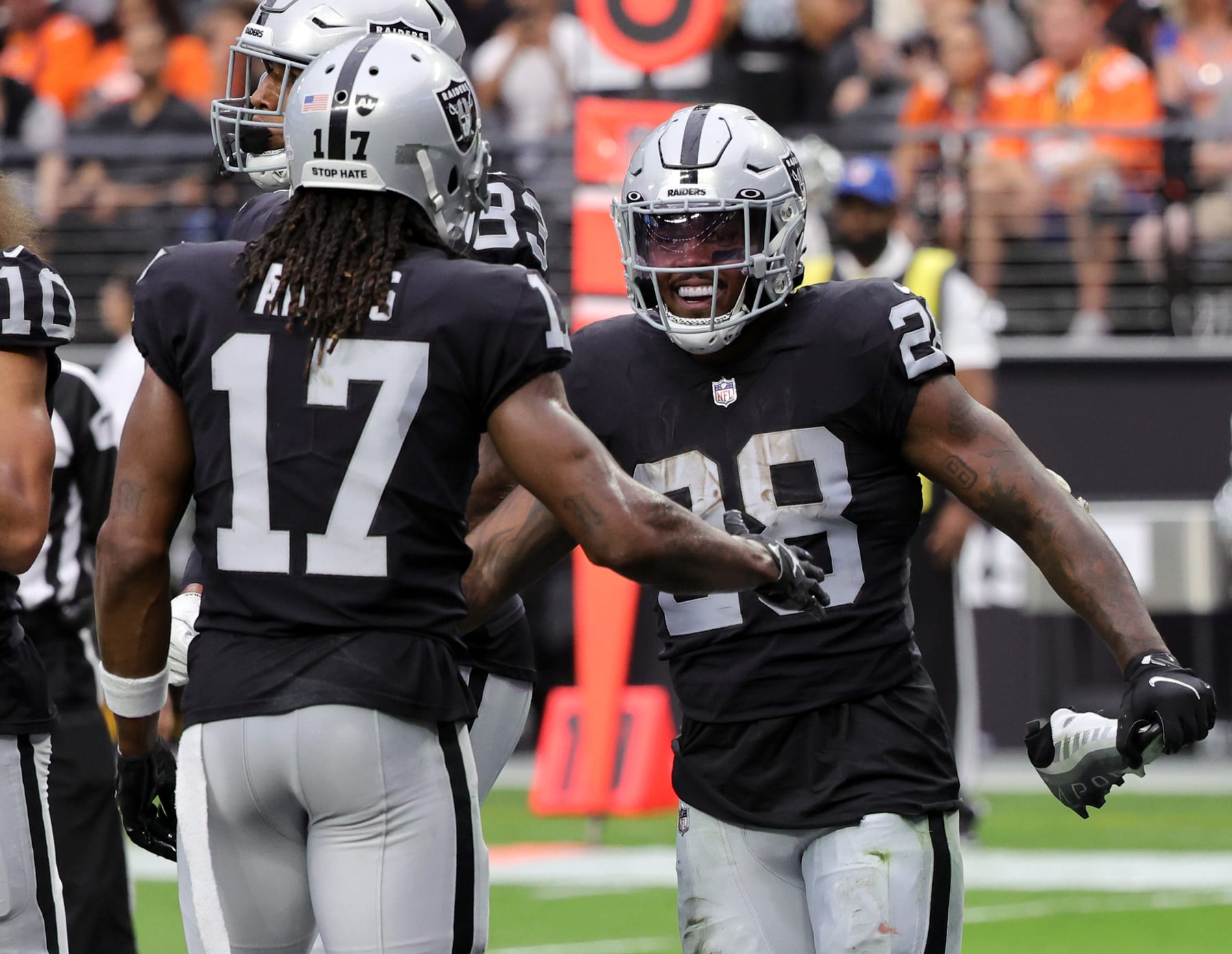 LAS VEGAS, NEVADA - OCTOBER 02: Wide receiver Davante Adams #17 and running back Josh Jacobs #28 of the Las Vegas Raiders celebrate after Jacobs ran for a 10-yard touchdown against the Denver Broncos in the second quarter of their game at Allegiant Stadium on October 02, 2022 in Las Vegas, Nevada. The Raiders defeated the Broncos 32-23. (Photo by Ethan Miller/Getty Images) LAS VEGAS, NEVADA - OCTOBER 02: Wide receiver Davante Adams #17 and running back Josh Jacobs #28 of the Las Vegas Raiders celebrate after Jacobs ran for a 10-yard touchdown against the Denver Broncos in the second quarter of their game at Allegiant Stadium on October 02, 2022 in Las Vegas, Nevada. The Raiders defeated the Broncos 32-23. (Photo by Ethan Miller/Getty Images)