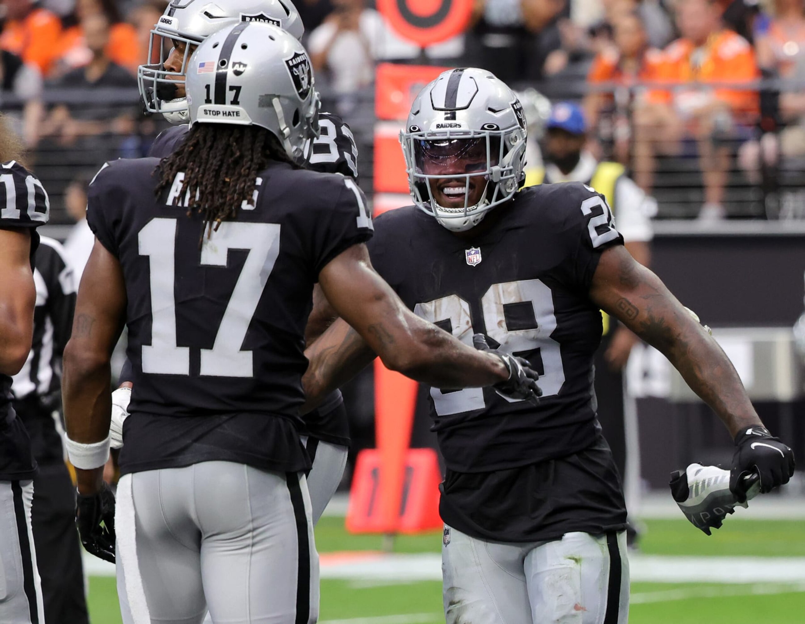 LAS VEGAS, NEVADA - OCTOBER 02: Wide receiver Davante Adams #17 and running back Josh Jacobs #28 of the Las Vegas Raiders celebrate after Jacobs ran for a 10-yard touchdown against the Denver Broncos in the second quarter of their game at Allegiant Stadium on October 02, 2022 in Las Vegas, Nevada. The Raiders defeated the Broncos 32-23. (Photo by Ethan Miller/Getty Images)